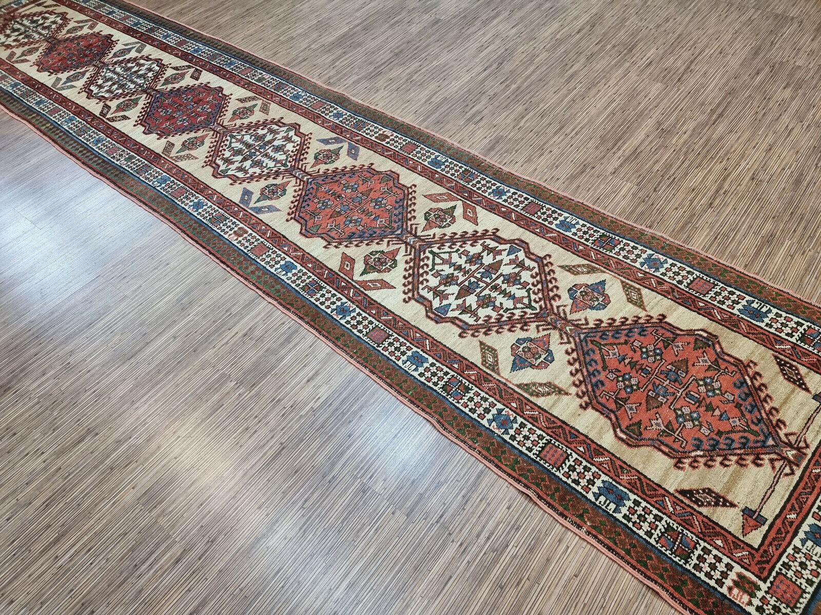 Immerse your space in the artistry of the Middle East with our Handmade Antique Persian Style Serab Runner Rug. Measuring at a generous 3.2’ x 14.9’, this long runner is a testament to timeless elegance and luxurious style.
Crafted meticulously from
