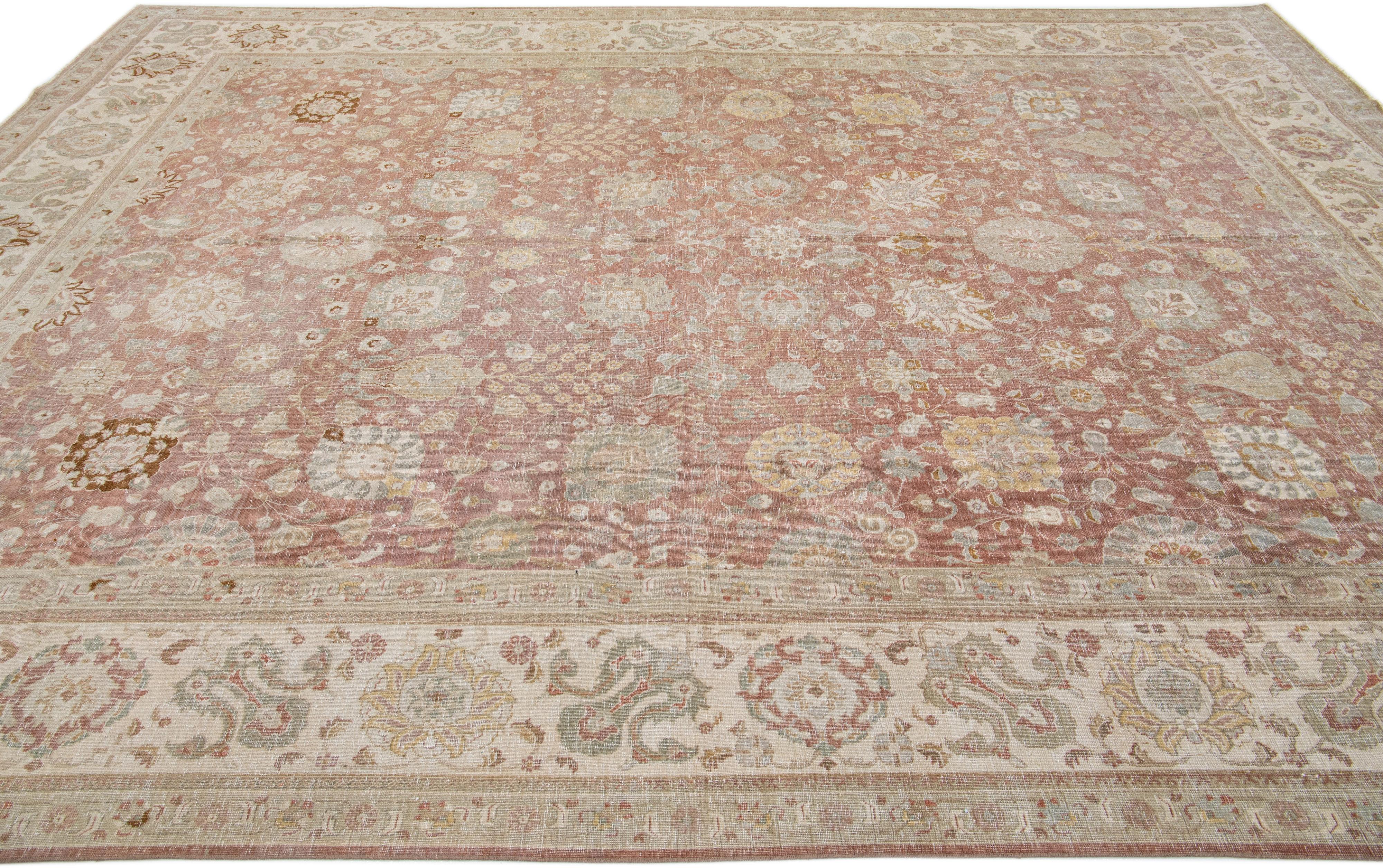 Handmade Antique Persian Tabriz Rust Wool Rug with Floral Design In Good Condition For Sale In Norwalk, CT