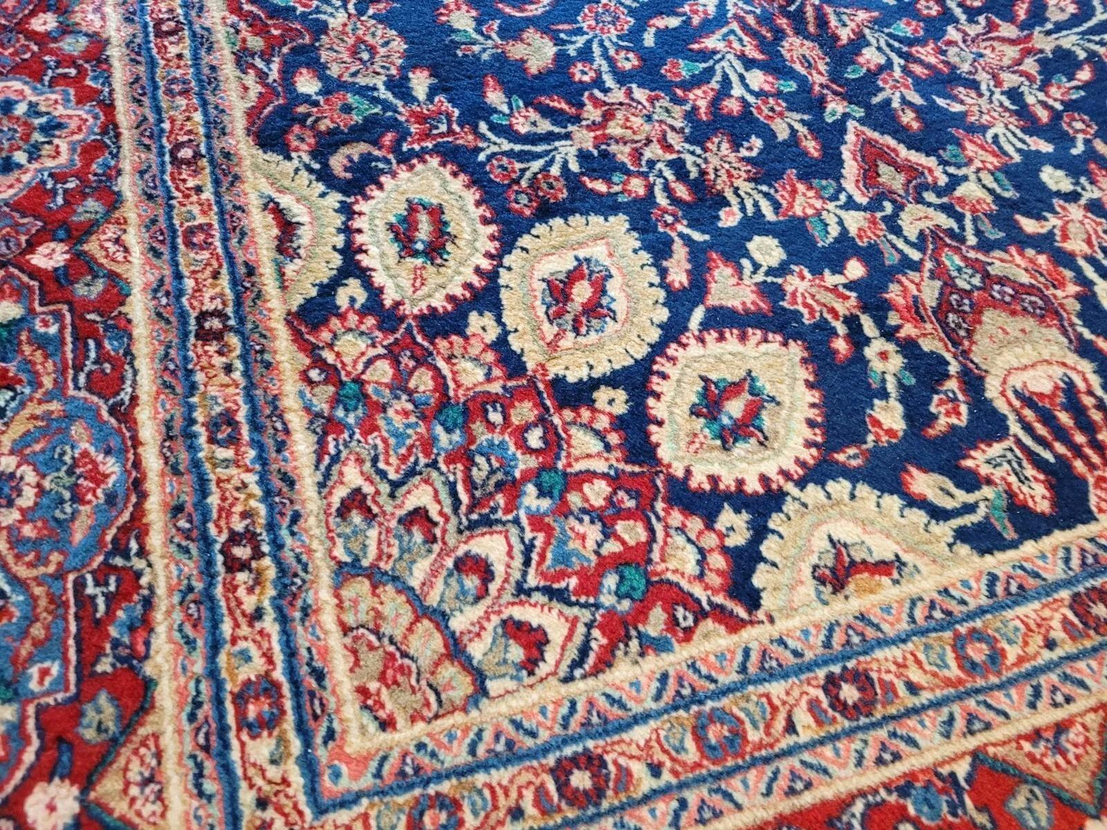A Glimpse into Persian Weaving Heritage
This exquisite handmade antique Persian Yazd rug, dating from the 1920s, offers a captivating journey into the rich artistic traditions of Yazd, a historic city in central Iran renowned for its fine carpet