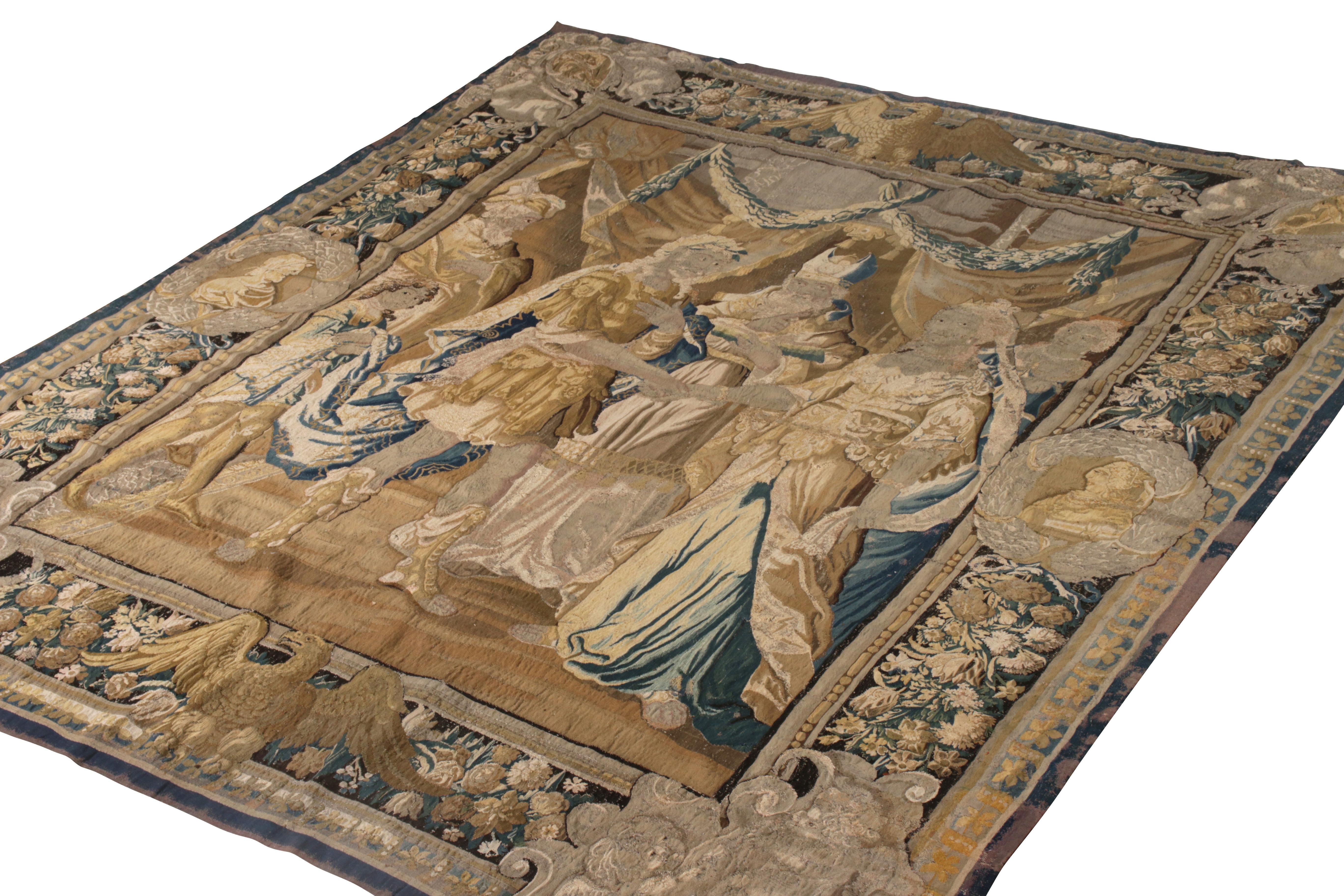 A 9 x 11 antique French tapestry of distinguished pictorial design, enjoying a play of beige-brown and blue with gold accents. Known among connoisseurs as a Heraldic design, handmade in France originating, circa 1900-1910.

On the design: The