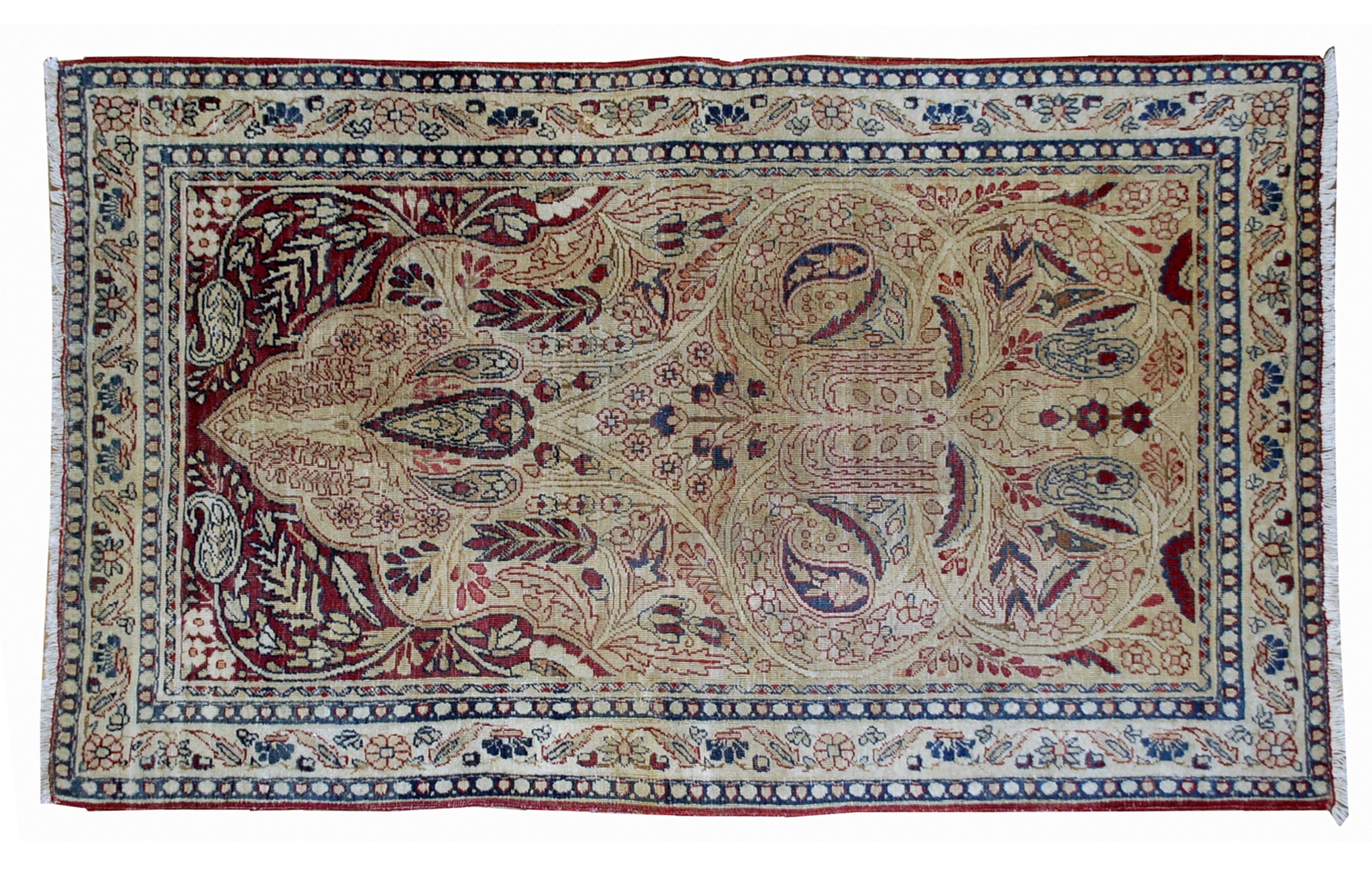 Kerman Lavar style rug in original condition, it has some low pile. The rug is prayer in beige and burgundy shades, made in the end of 19th century.

-condition: Original, some low pile,

-circa 1880s,

-size: 2.10' x 4.8' (90cm x