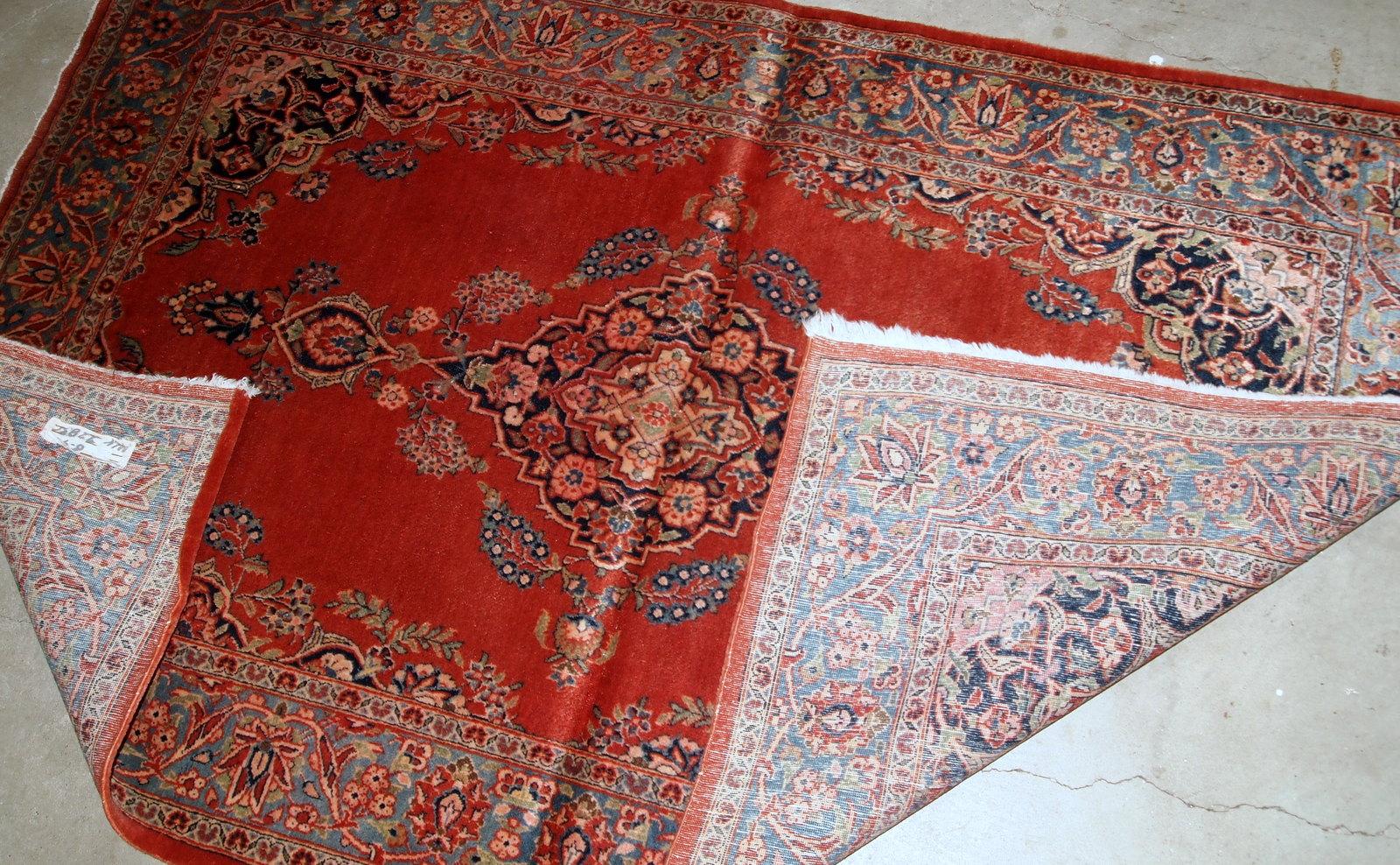 Handmade antique Sarouk style rug in original good condition. The rug is from the beginning of 20th century made in bright red wool. 

?-condition: original good,

-circa: 1910s,

-size: 3.4' x 5.3' (103cm x 161cm),

-material: