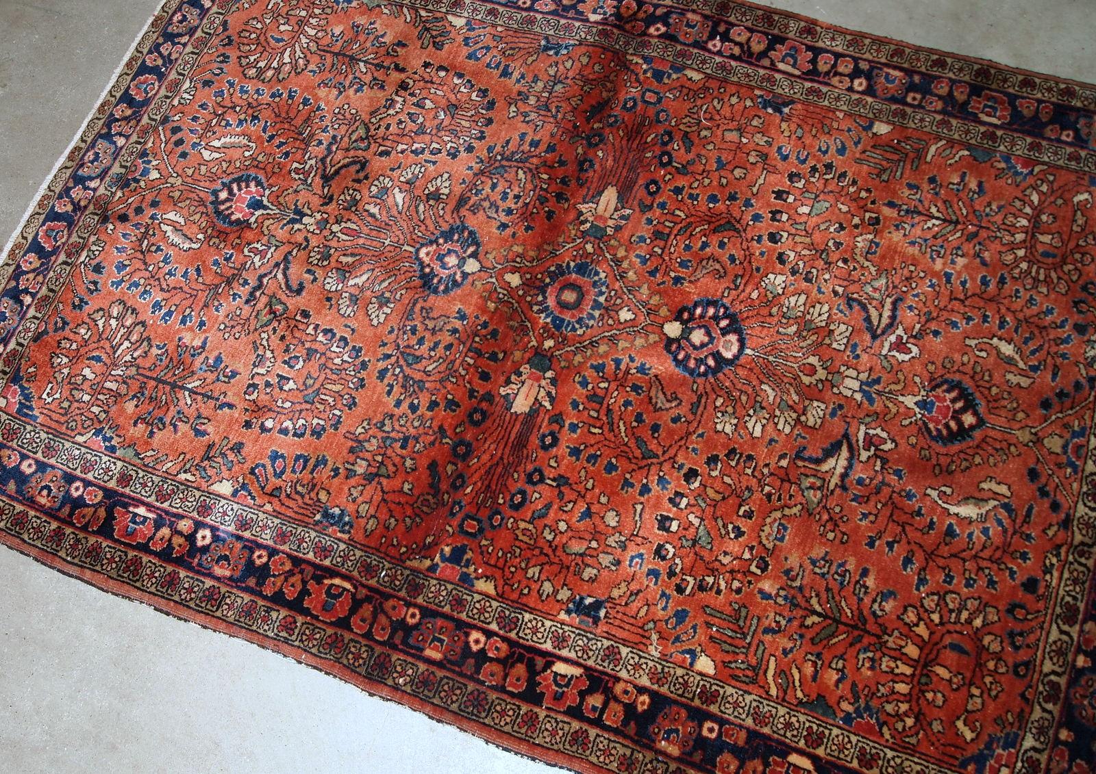 Handmade antique Sarouk style rug in original good condition. The rug is from the beginning of 20th century made in bright red wool. 

?-condition: original good,

-circa: 1920s,

-size: 3.5' x 5.5' (106cm x 167cm),

-material: