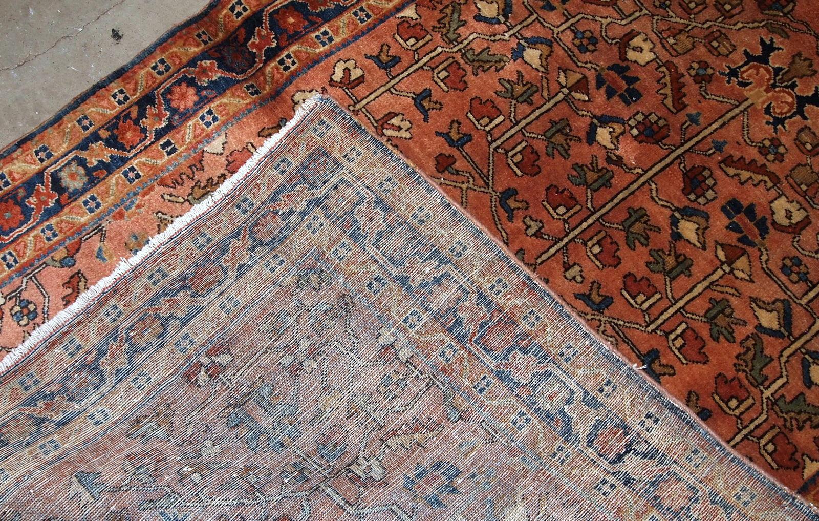 Handmade antique Sarouk style rug in original good condition. The rug is from the beginning of 20th century made in pale red wool and unusual design.

-Condition: Original good,

-circa 1920s,

-Size: 3.7' x 5.4' (113 cm x 164
