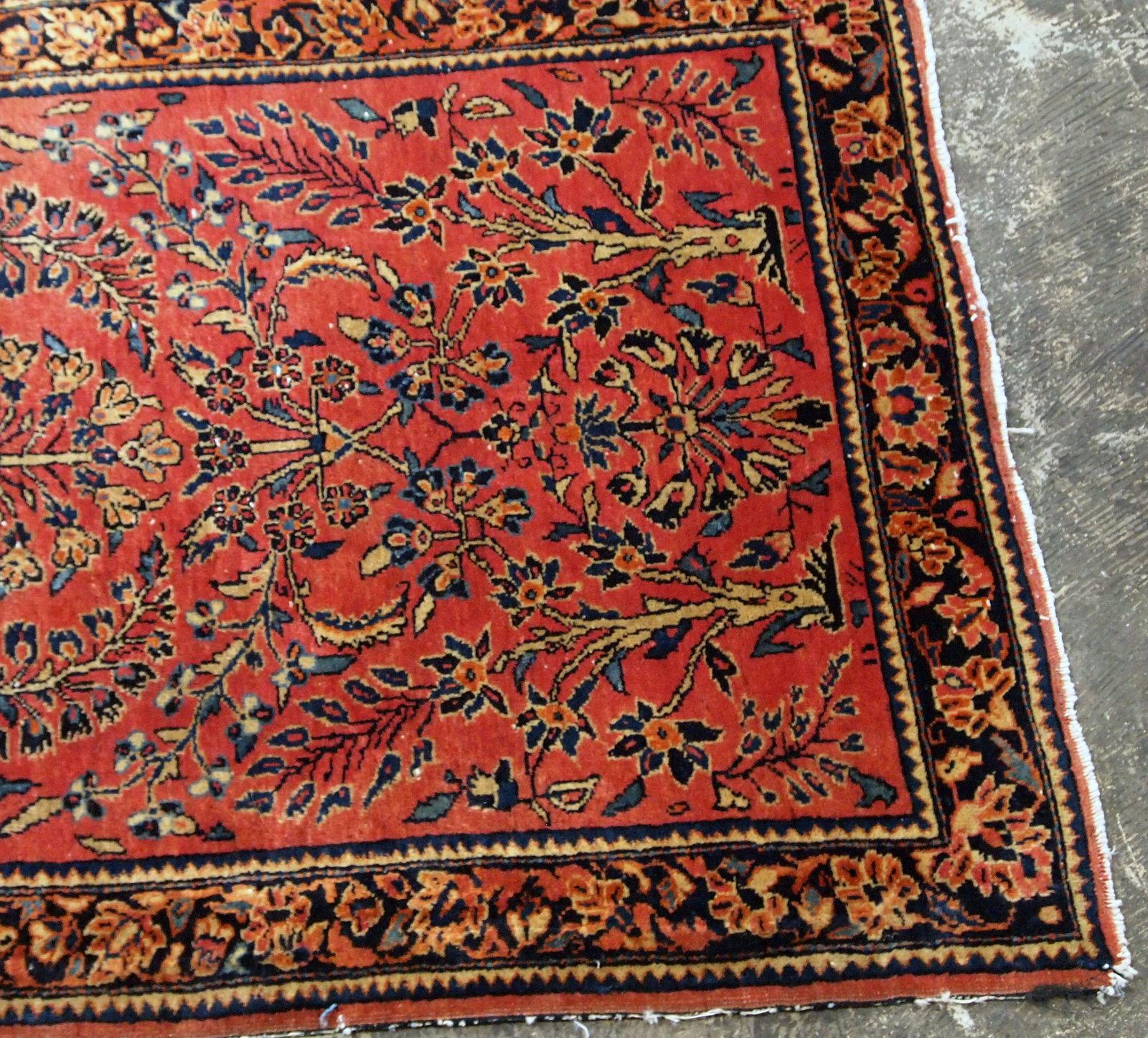 Antique handmade Persian Sarouk runner in red wool and floral design. The rug made in 1900s and it is in original good condition.

 