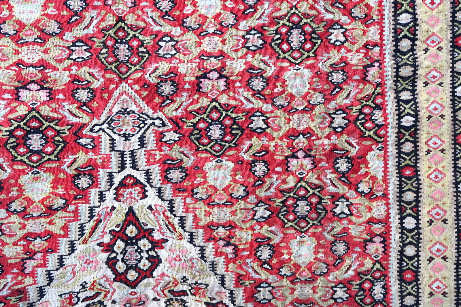 Handmade antique kilim from Middle East in red and colour. The rug is from the beginning of 20th century in original good condition ( it always has been hung on the wall).

?-condition: original good, 

-circa: 1920s,

-size: 3.9' x 6.4'