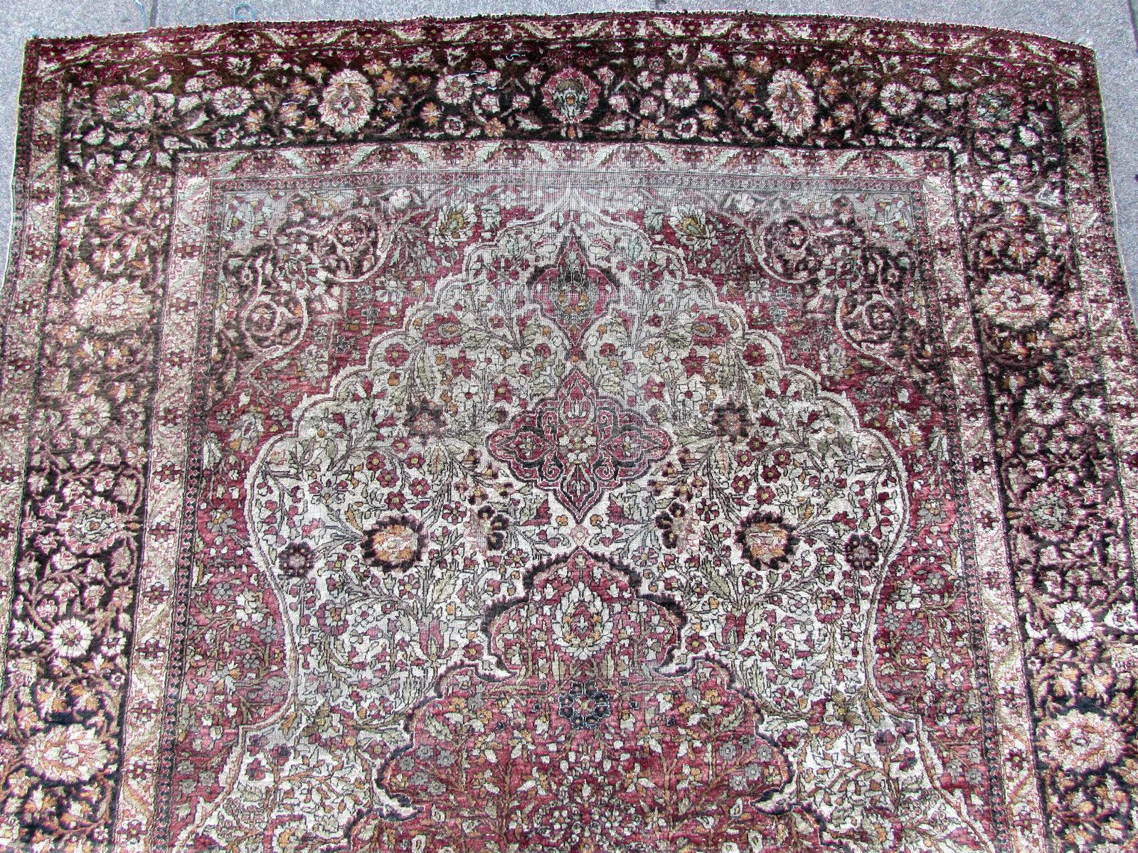 Handmade antique Tabriz rug made in silk. The rug is from the beginning of 20th century, it is in original condition, has some low pile and age wears.

-Condition: Original, some low pile, age wear,

-circa 1910s,

-Size: 4.3' x 7' (127cm x