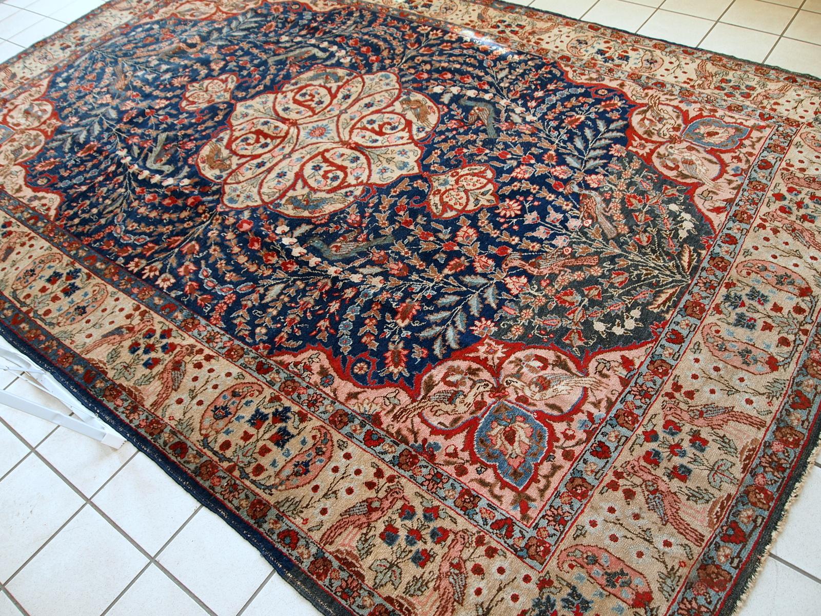 Antique Tabriz rug in original good condition. This beautiful masterpiece made in the beginning of 20th century in navy blue and pink shades.

 