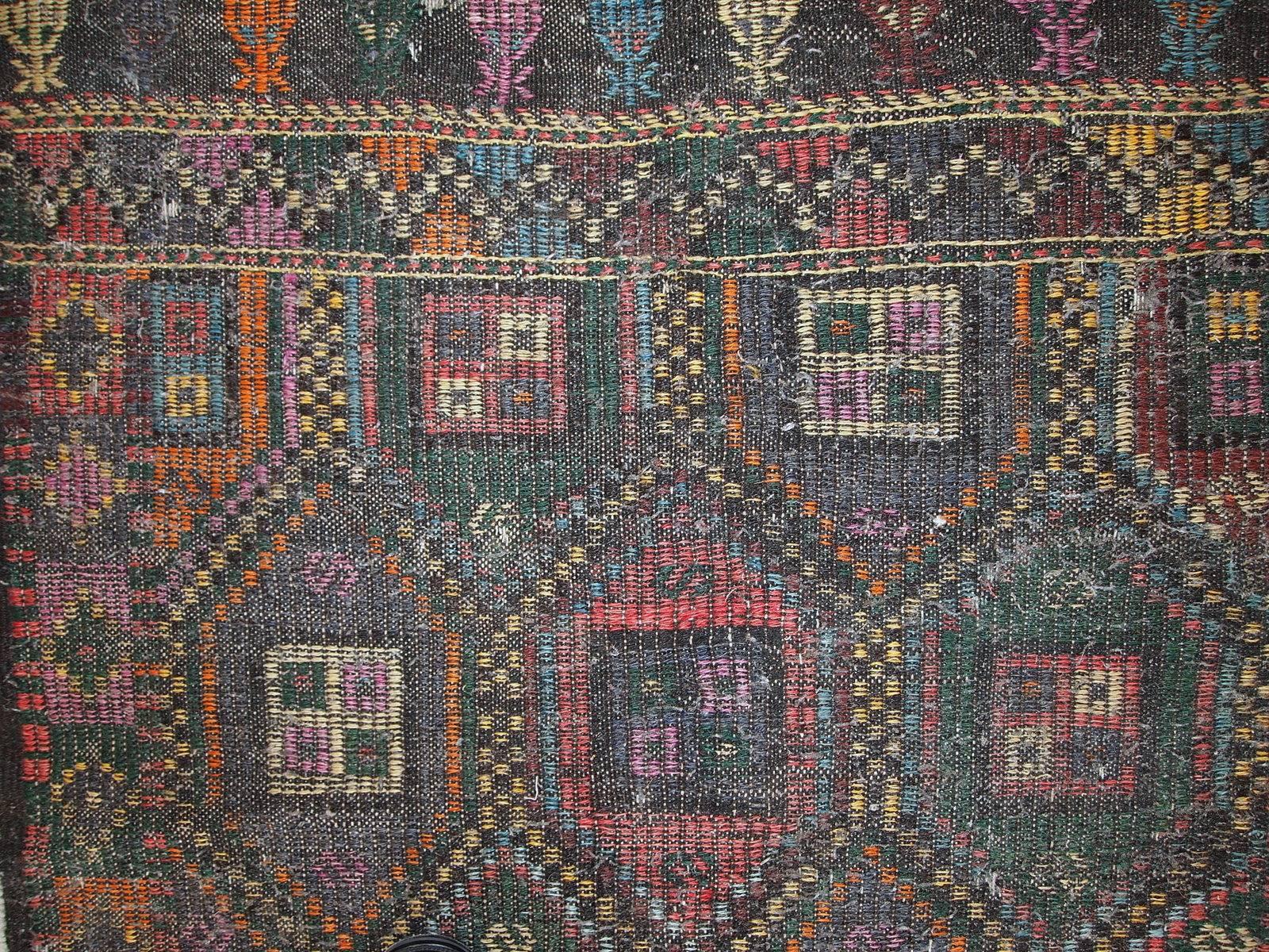 This flat-weave made in Tunis, circa 1930s. It is in original condition, has some signs of age. Geometric design and beautiful shades of grey, pink, yellow, sky blue and grass green. The Kilim made in bamboo cotton, it is very strong.
 