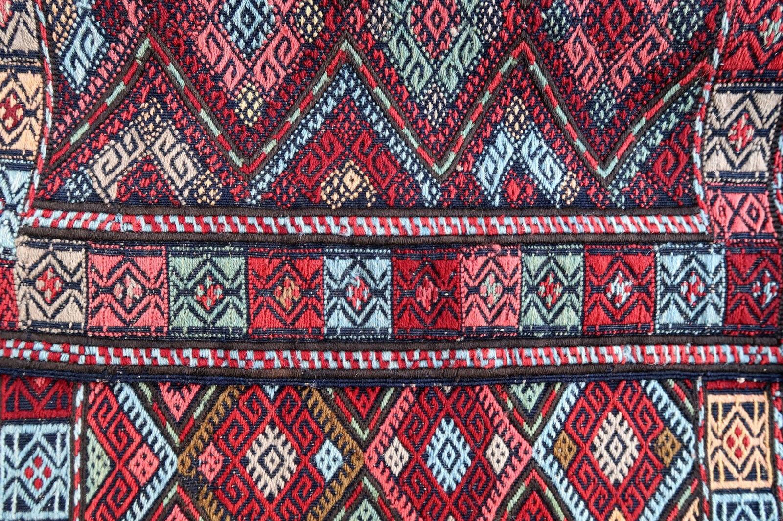 Antique Anatolian bag face from Turkey in Kilim style. The rug is from the beginning of 20th century in original good condition.

- Condition: Original good,

- circa 1900s,

- Size: 1.8' x 3.5' (56cm x 106cm),

- Material: Wool,

-