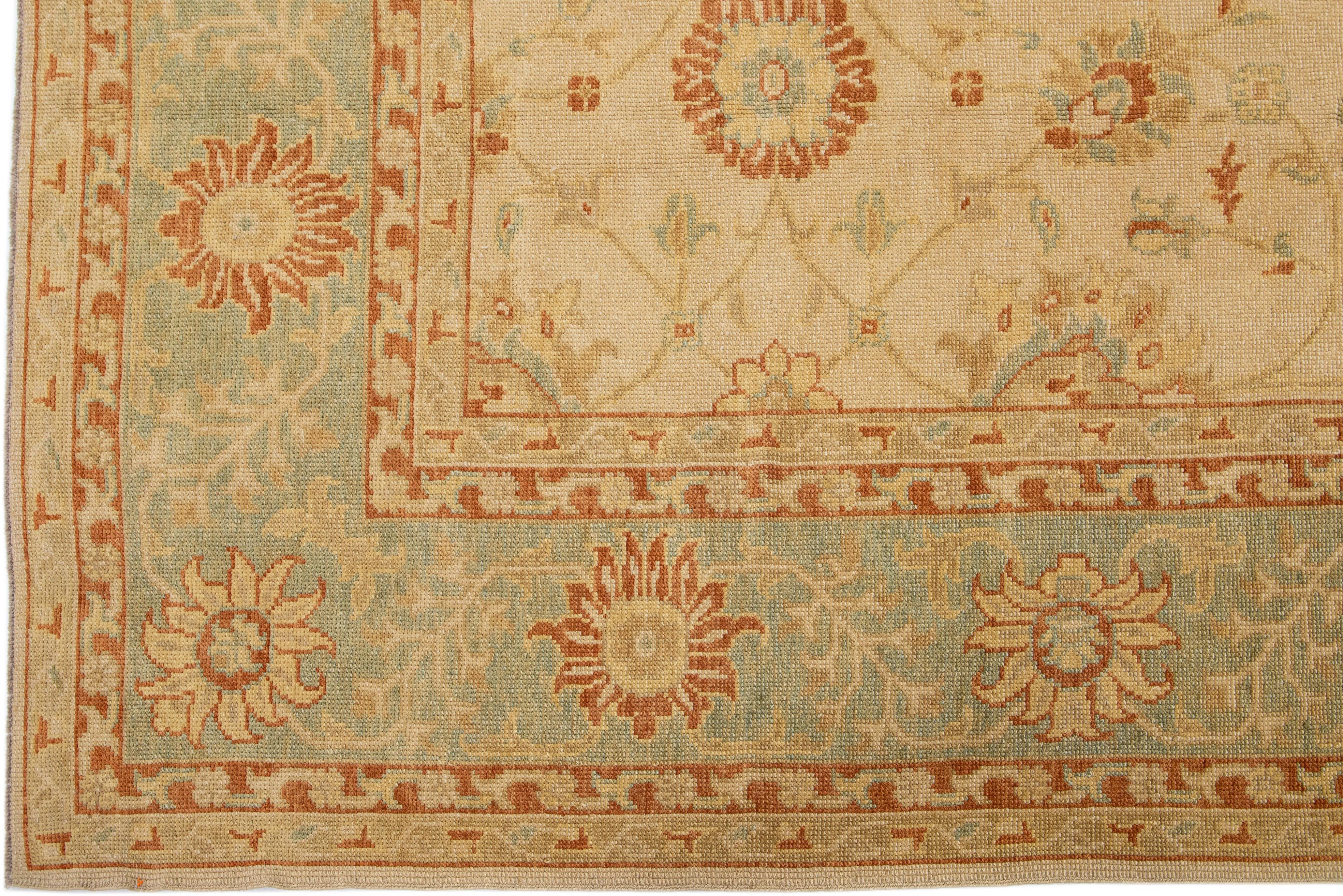 Hand-Knotted Handmade Modern Turkish Wool Rug with Tan Floral Field For Sale