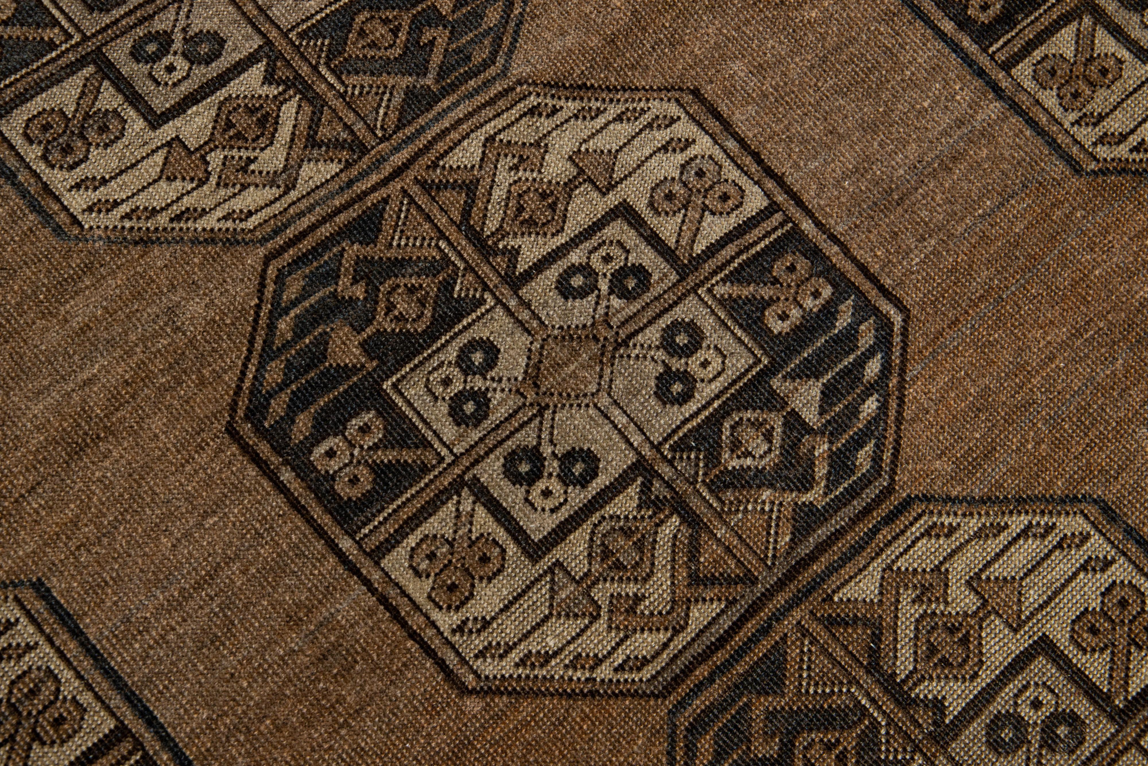 20th Century Handmade Antique Turkmen Persian Wool Rug with Allover Octagonal Pattern For Sale