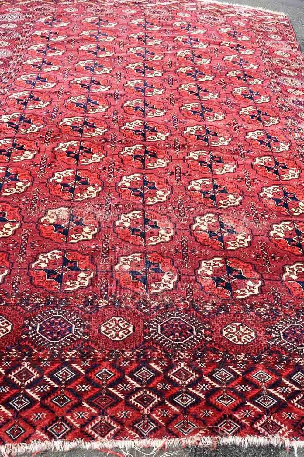 Handmade antique Turkmen Tekke rug in traditional design. The rug is from the end of 19th century in original condition, it has some low pile.

-condition: original, some low pile,

-circa: 1870s,

-size: 6.8' x 8.6' (210cm x