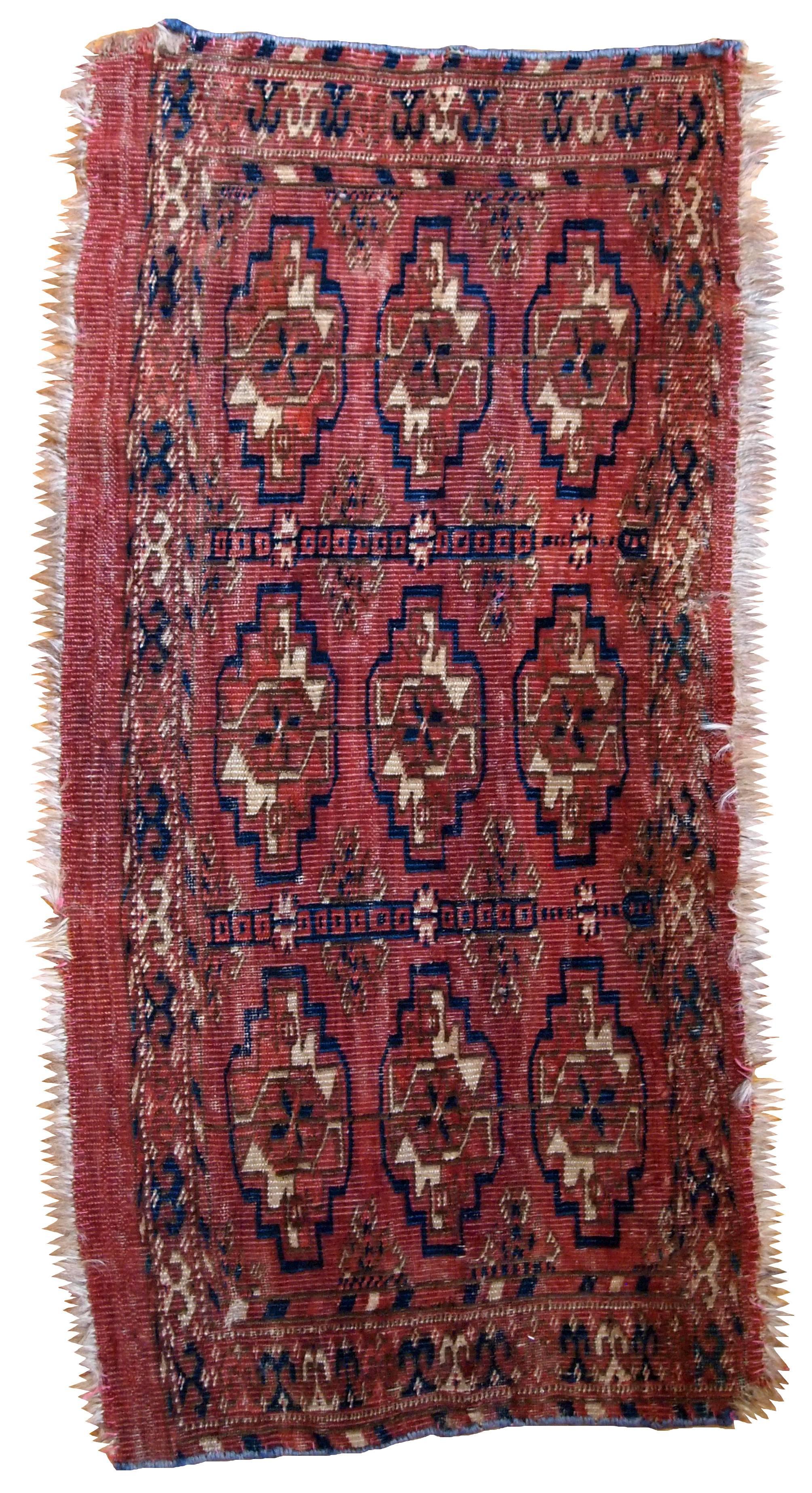 Antique Turkmen Tekke Torba in unusually small size. It is from the middle of 19th century, has some low pile.
 