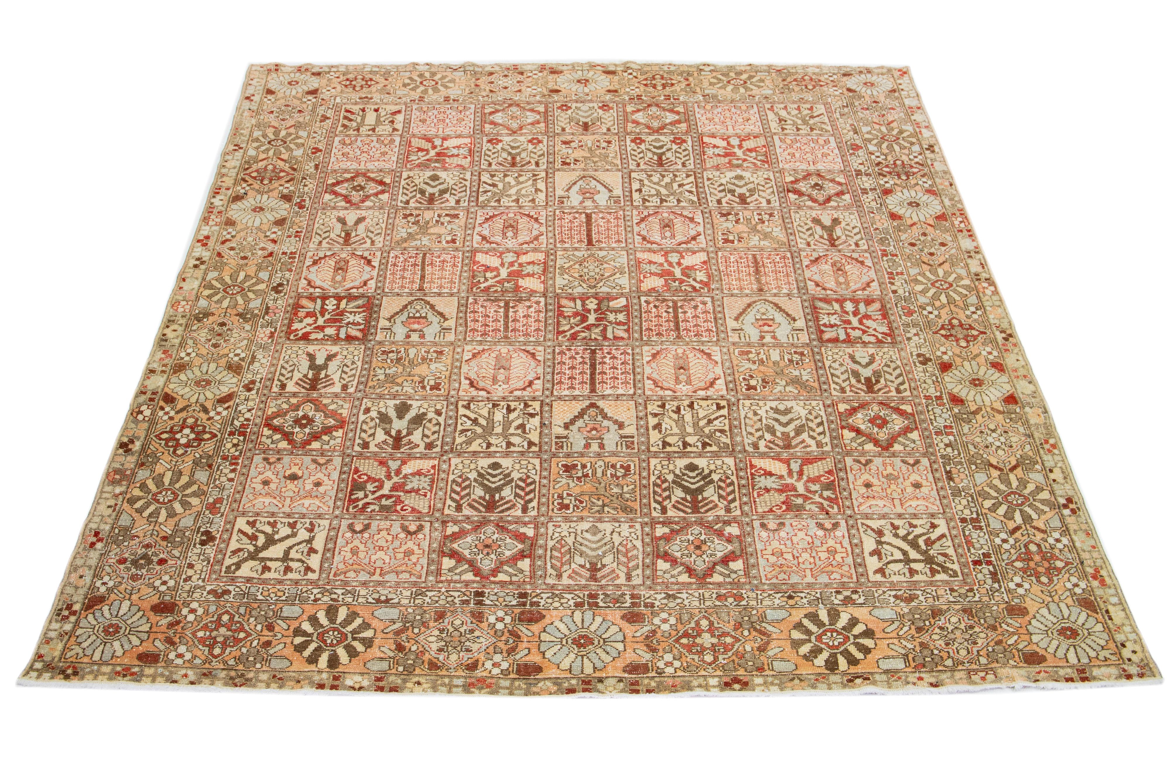 This beautiful Antique Bakhtiari hand-knotted wool rug features a color field in red rust, blue, beige, and peach shades. This Persian piece showcases a timeless floral pattern.

This rug measures 10' x 12'.
 