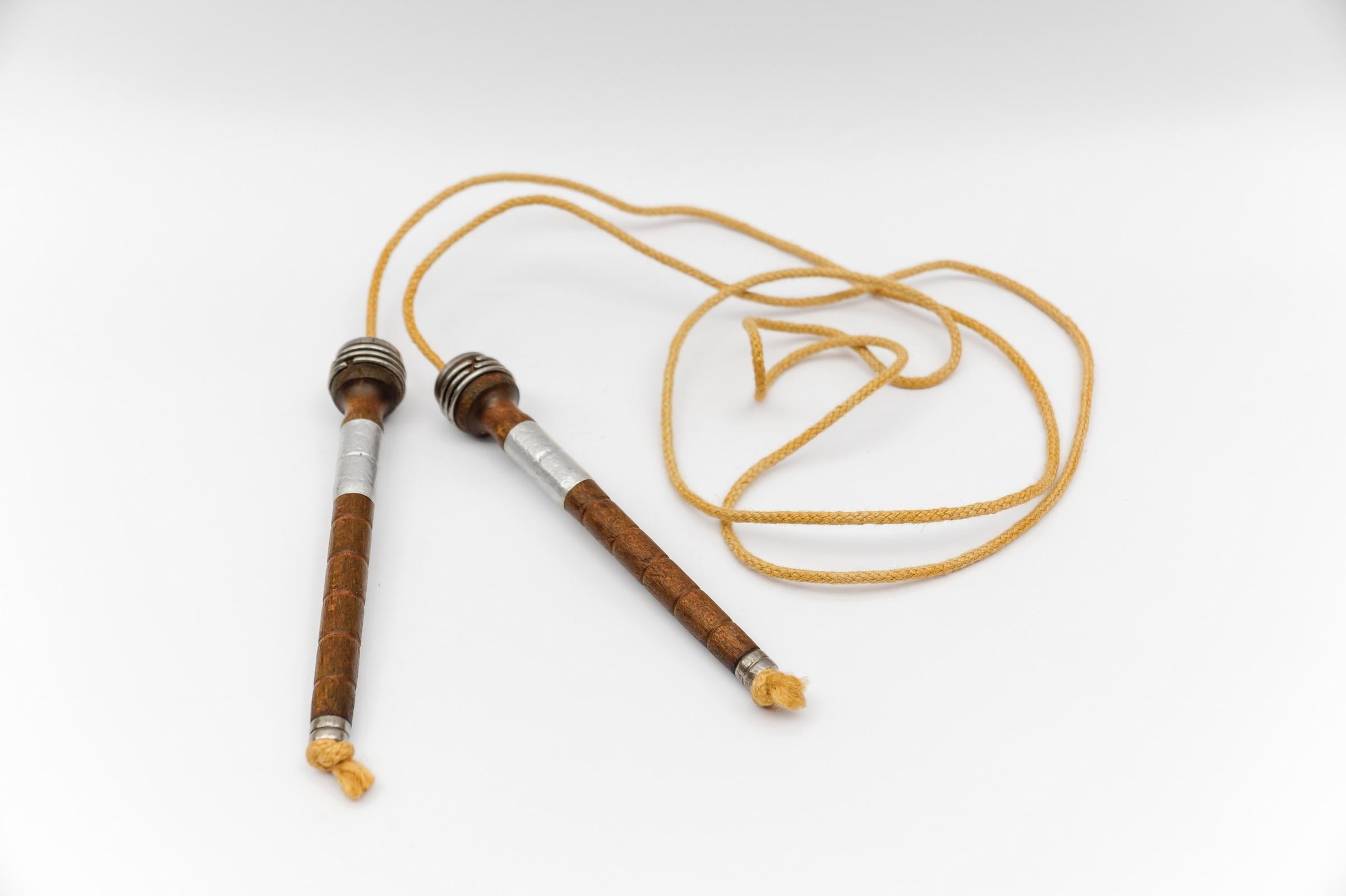 A very rare handmade skipping rope from the 1930s. The handle length is 20.5cm, the rope 220cm.