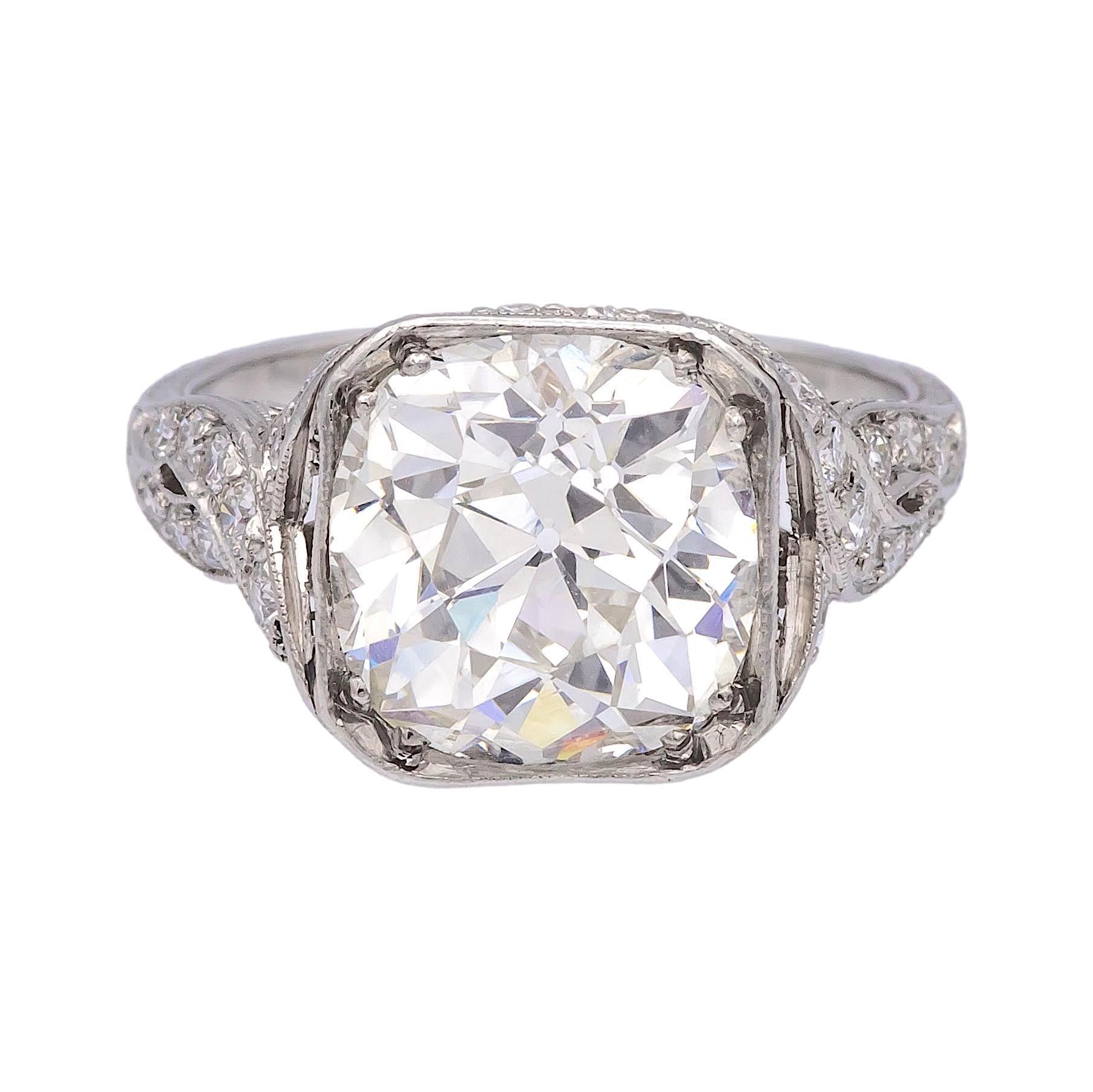 This elegant handmade Art Deco ring features a stunning 4.11-carat Old Mine cut diamond, ( Dating pre-1900’s) graded I color and VS2 clarity (GIA certified). The platinum setting, crafted in the 1920s-1930s, showcases intricate milgrain detailing