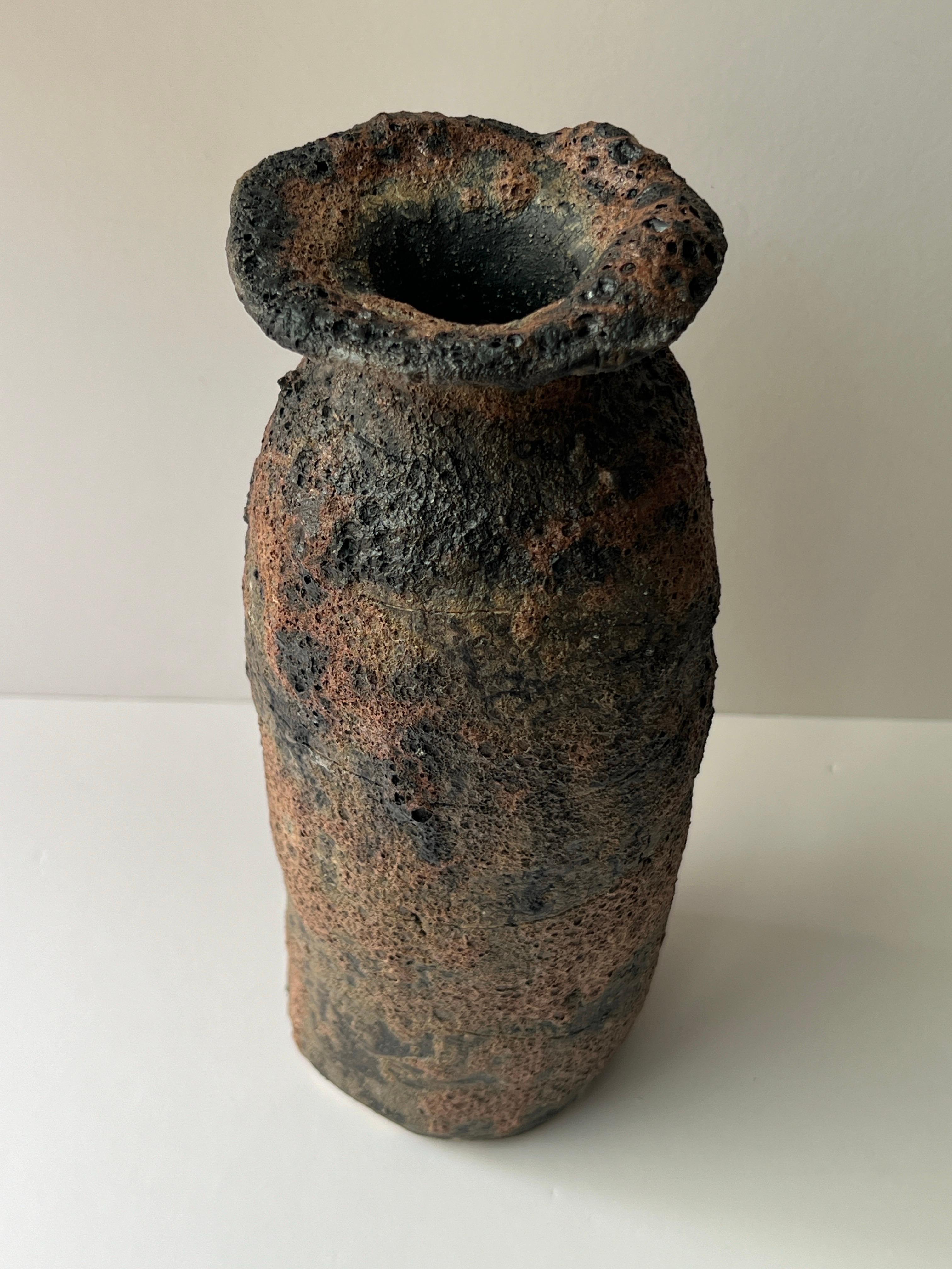 This handmade vase is one of the four pieces in the Twilight Collection and carries a meaningful story. This collection represents one’s belief in the light that follows every darkness, symbolizing resilience through hardships. The holes and lines