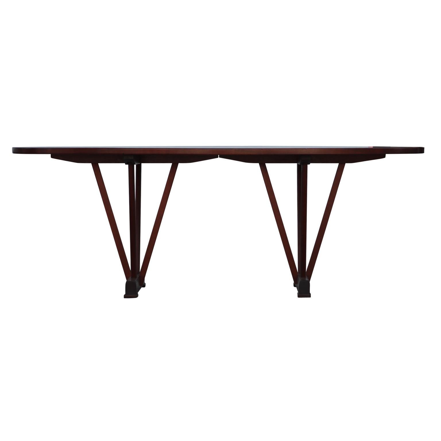 Unique Asian inspired handmade oval coffee table with a modern sculptural design. The table is made out of a beautiful quilted mahogany.