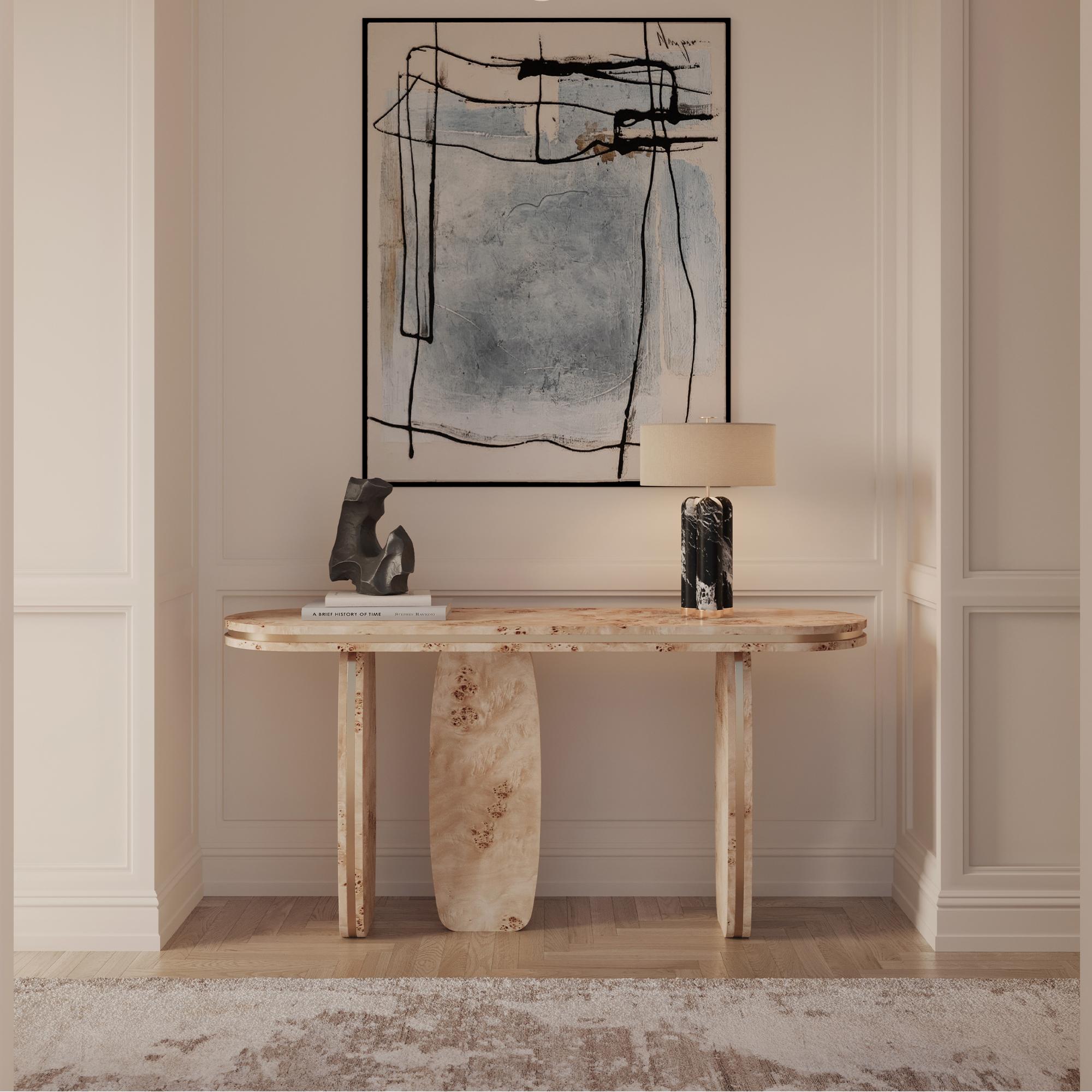 The Assia console table is a refined adaptation of our signature Assia dining table, reimagined into an elegant and sculptural console piece. Crafted with poplar root veneer, this table showcases a mesmerizing grain pattern that adds depth and