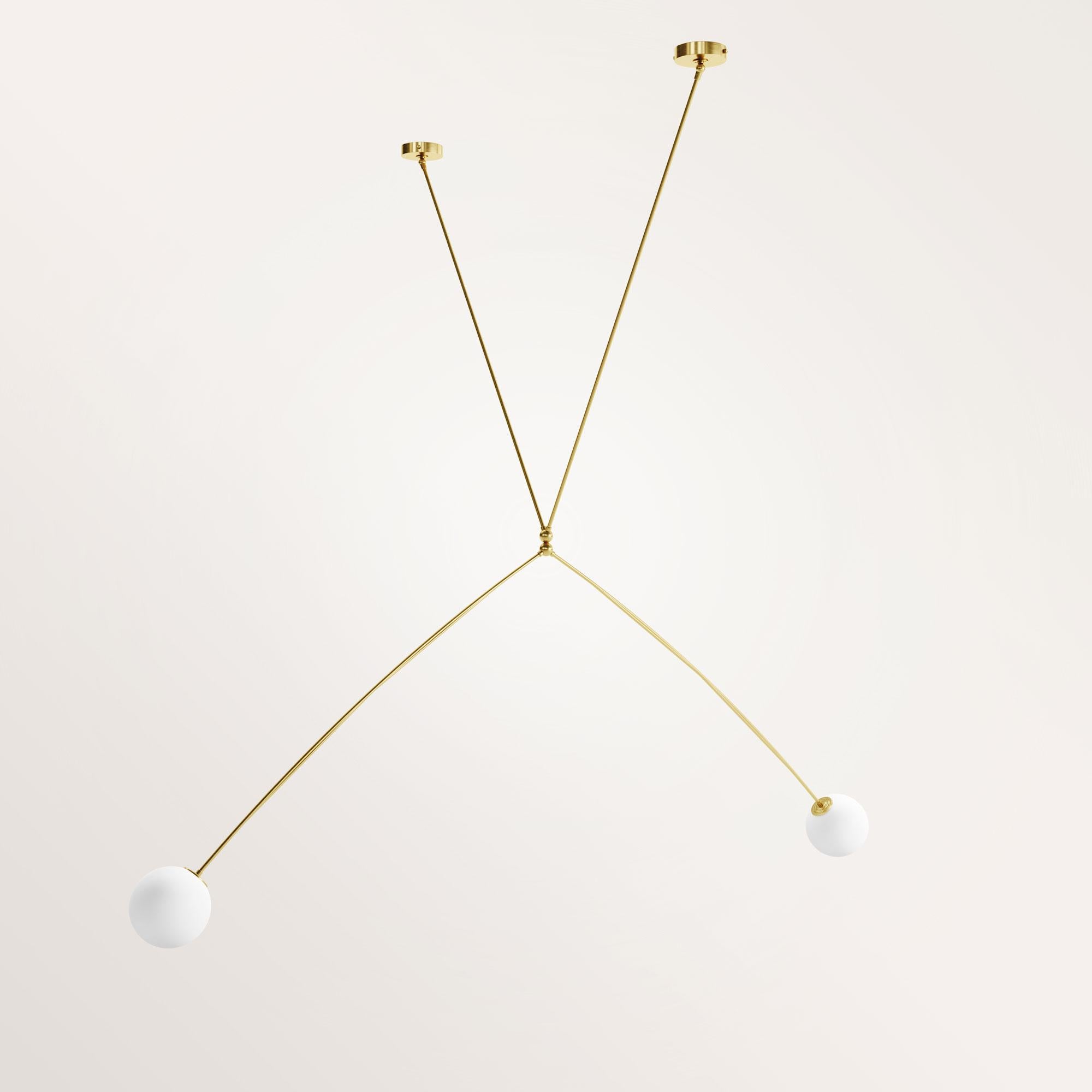 Handmade Athos chandelier by Gobo Lights
Dimensions: 190 L X 110 L X 170 H
Materials: Brass, Opaline

This lamp takes the shape of the bow used by Artemis, the goddess of the hunt.

Self-taught and from the world of chemistry, this Belgian