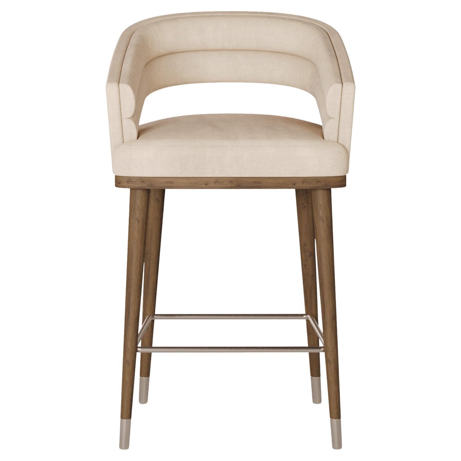The Ava Bar Chair by Nolita Harbour is a striking blend of contemporary design and timeless elegance, perfect for enhancing the luxury and sophistication of any bar or kitchen area. With its elegant silhouette and impeccable craftsmanship, this bar