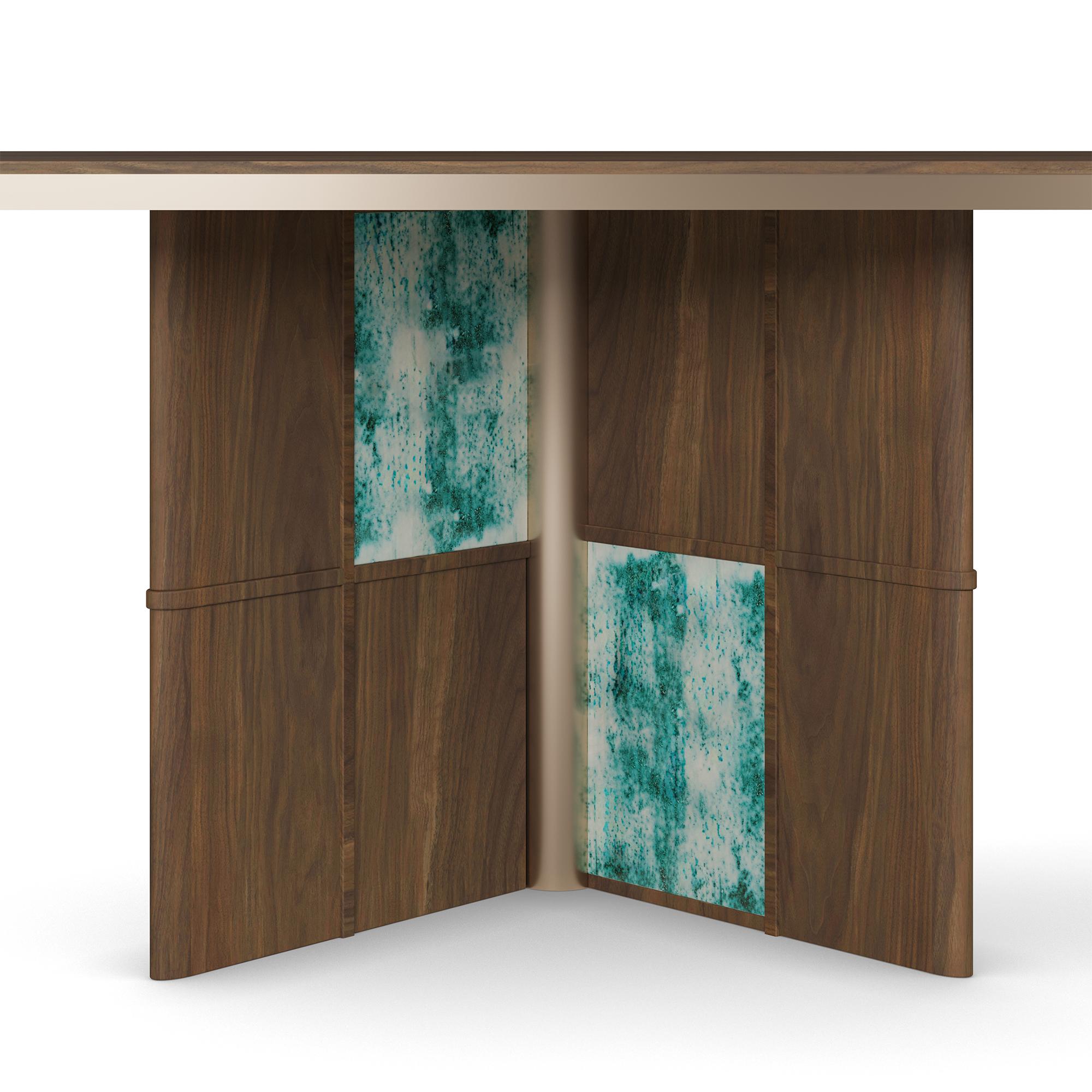 Il tavolo da pranzo Axelle di Nolita Harbour è un capolavoro di artigianato moderno che fonde perfettamente materiali di lusso, design scultoreo e dettagli artigianali. Il tavolo è caratterizzato da un elegante piano in noce con bordi lisci e curvi,
