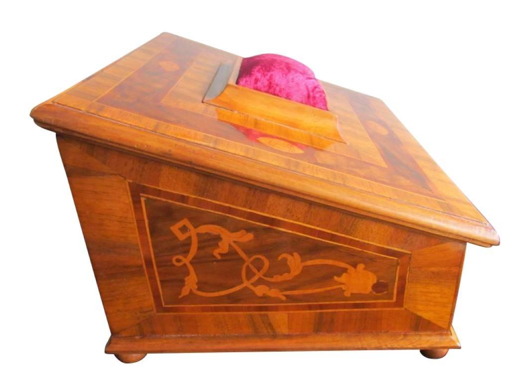 This charming Baroque casket has been made out of old veneer and was handcrafted in 2000 by a restorer of the Goethe Institute in Frankfurt am Main in Germany. The box is inlaid in walnut and plum, the little stars on the side are made of ebony. The