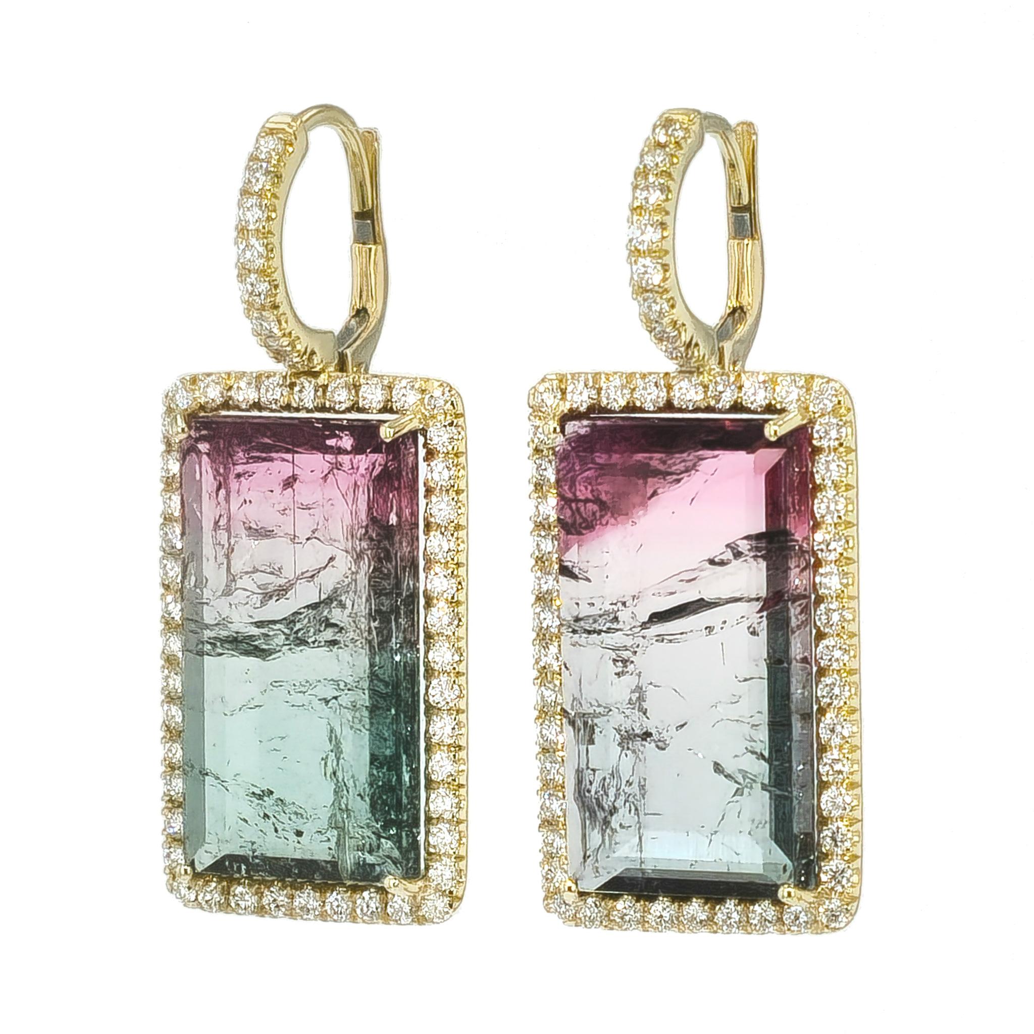 These one of a kind, handmade earrings are crafted in 18 karat gold. They boast 26.94 carats of stunning, bi-colored tourmalines that are artfully accompanied by 104 brilliant cut diamonds. 

These delicious earring measure 37 mm long and 15 mm
