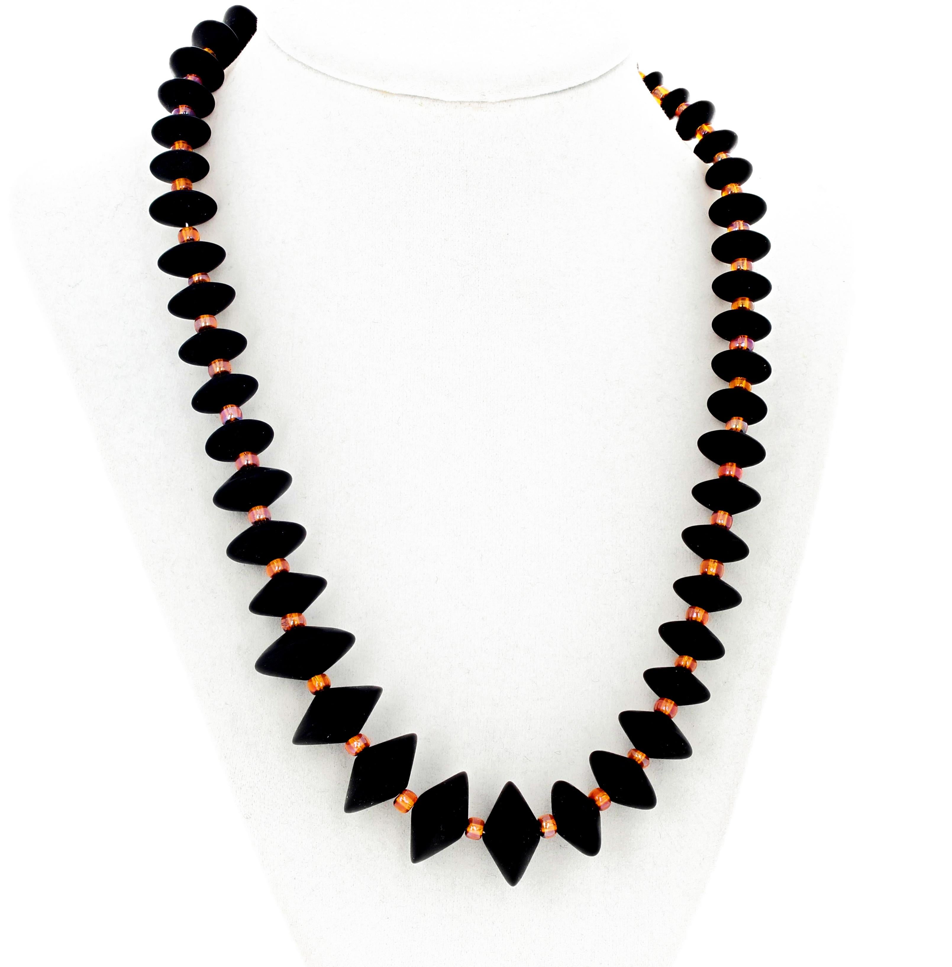 Unique real Black Onyx (largest 20 mm) enhanced with glittering goldy-orangy Czech crystals 19.5 inch long necklace with gold tone clasp.  This is truly elegant on a blouse or sweater.