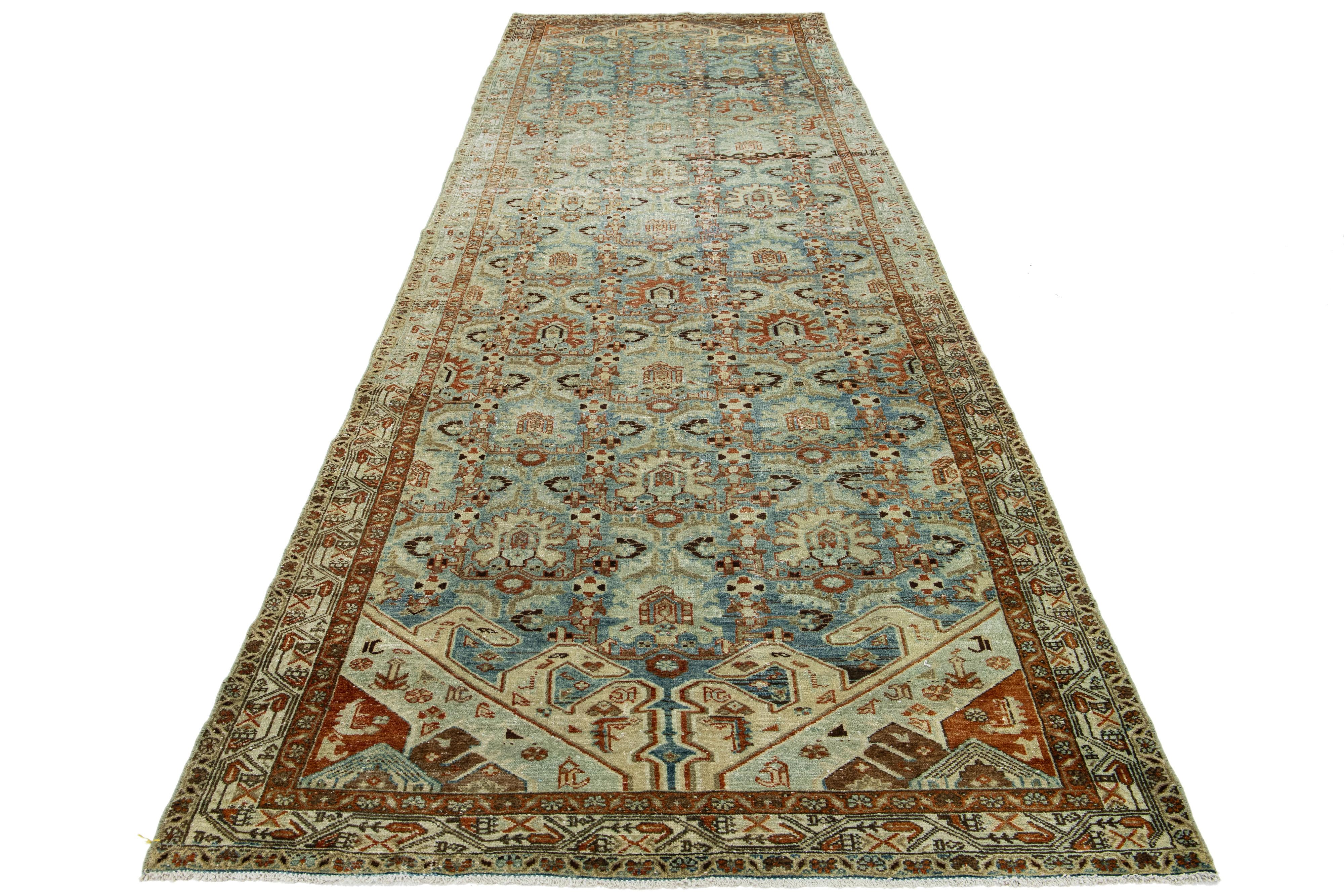 Antique Hamadan Persian runner with premium wool and captivating all-over design in beige and rust accents on a light blue background.

This rug measures 4'11