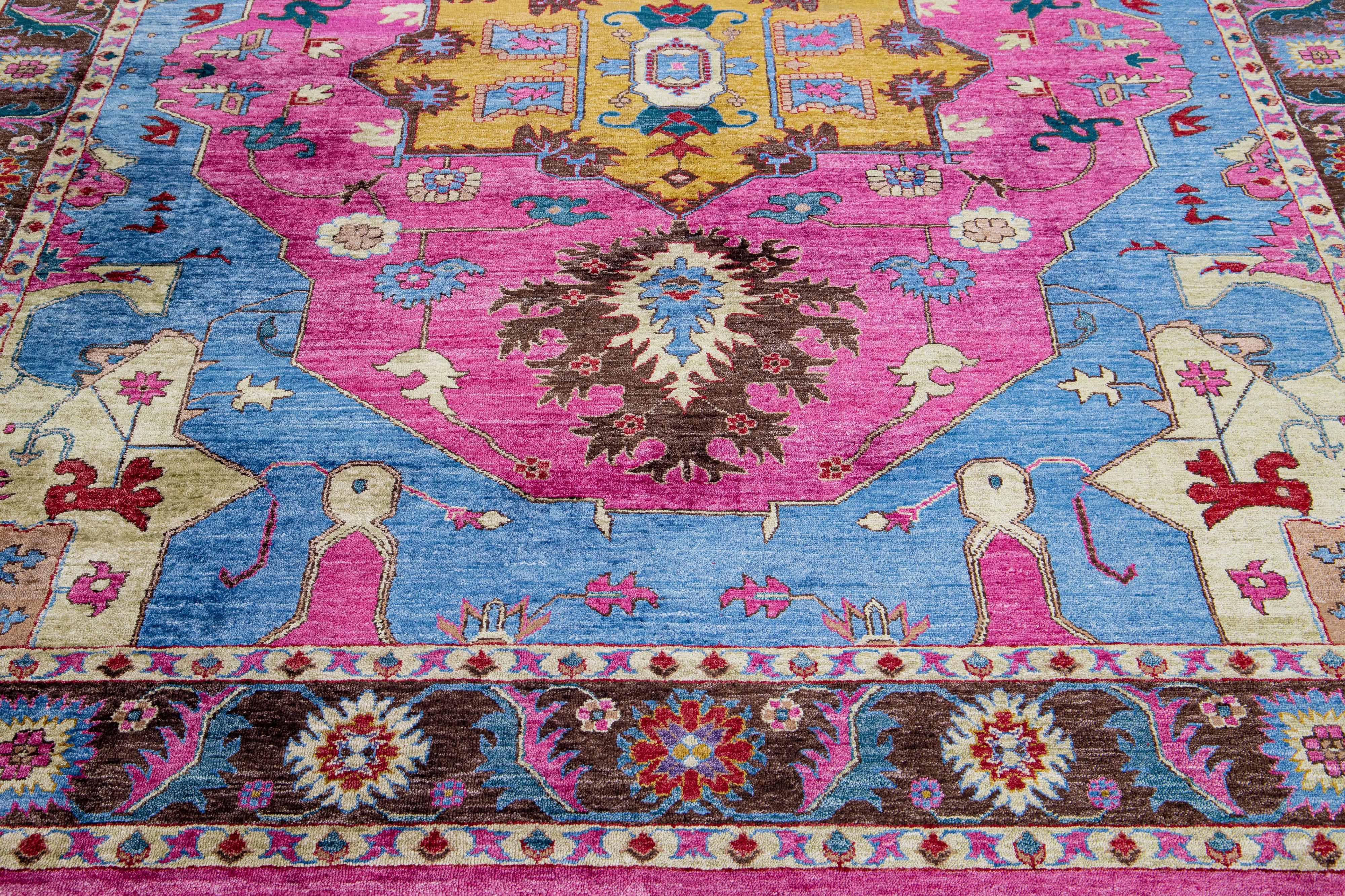 Stunning in its contemporary style, this silk rug showcases a mesmerizing all-over design in a captivating shade of blue. Its allure is heightened by the exquisitely crafted pink accents that effortlessly harmonize with the distinctive medallion