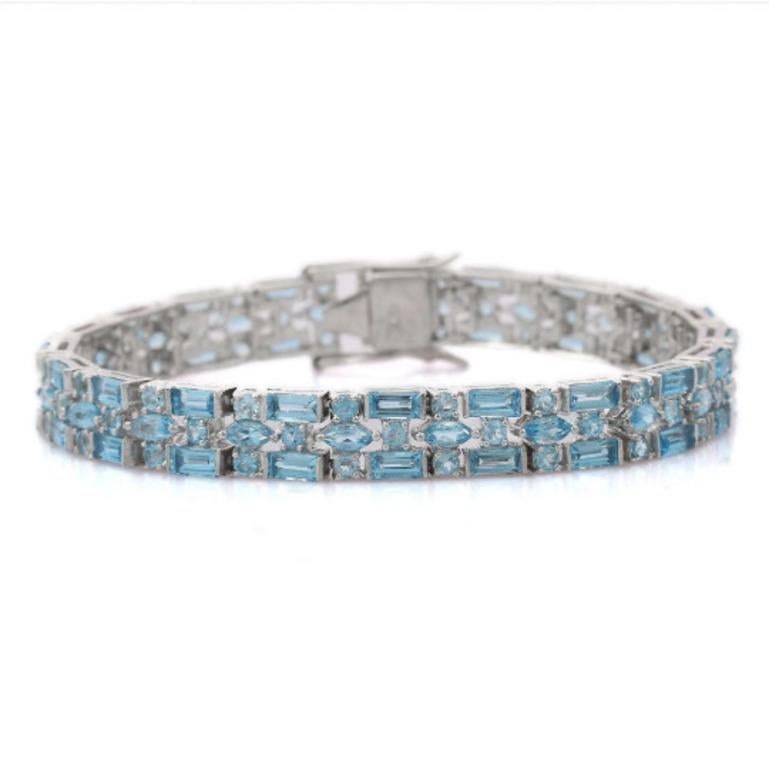 Handmade Blue Topaz Sterling Silver Wedding Bracelet in sterling silver showcases endlessly sparkling natural blue topaz, It measures 7 inches long in length. 
Blue Topaz stimulate concentration and reduces stress. 
Designed with perfect octagon cut