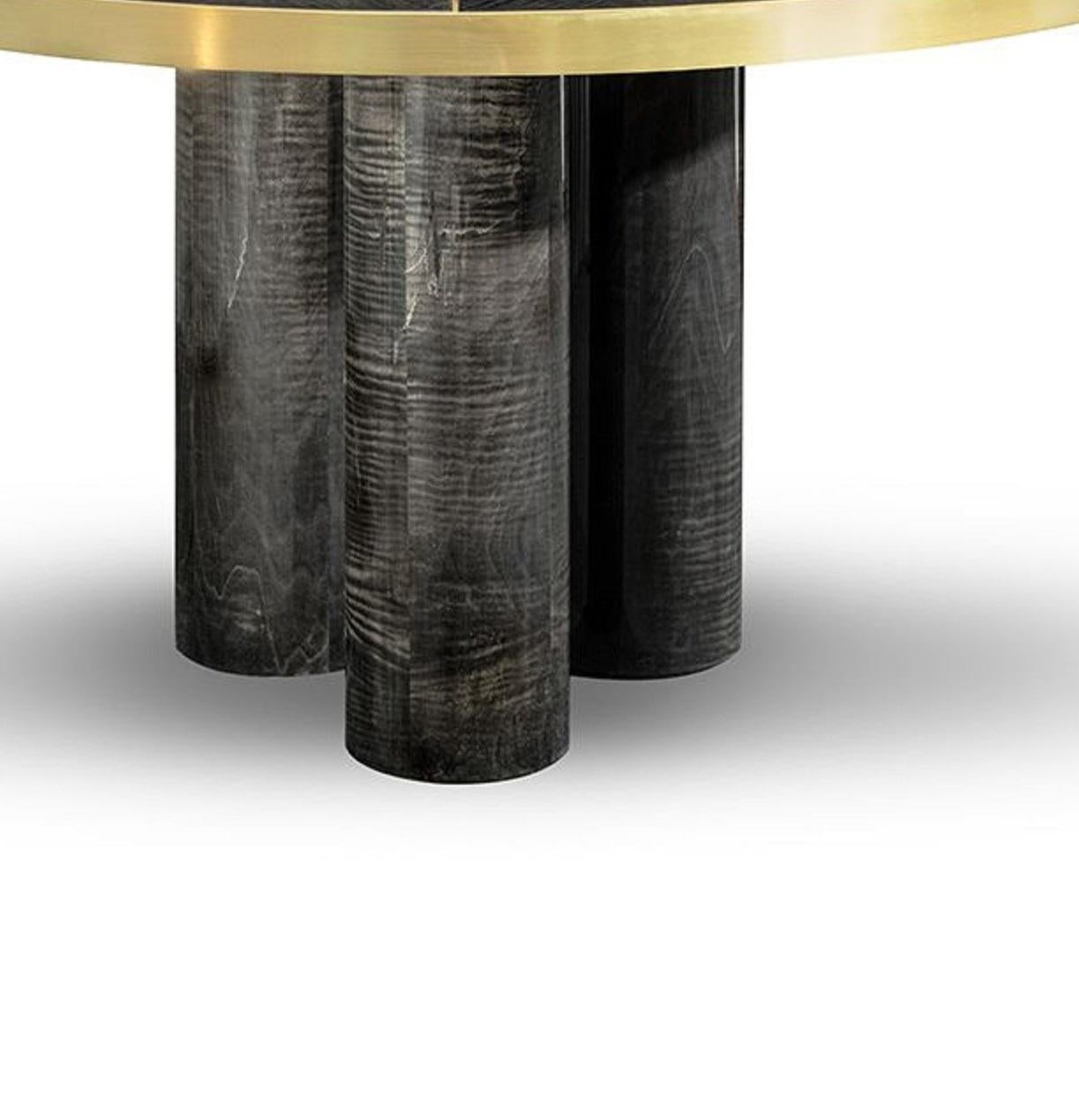 Ray dining table

The RAY dining table is presented with a sturdy figure. The delicate brushed brass lines define and give dimension to this finest design handmade with high gloss grey figured sikomoro. A bold and statement dining table that