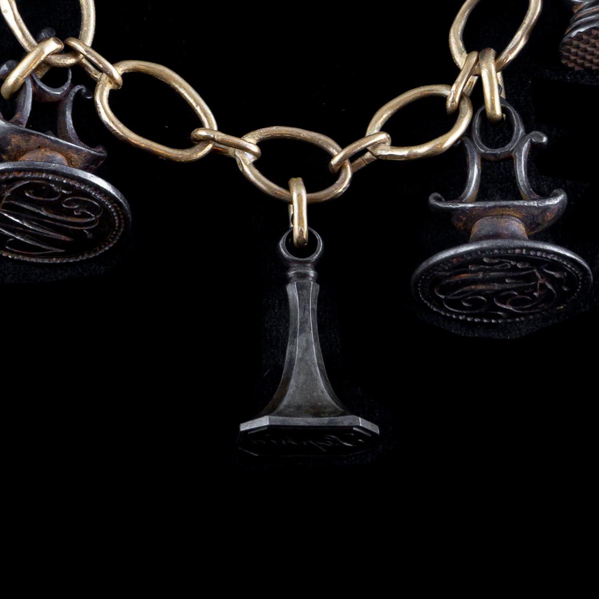 Handmade bronze chain necklace with antique steel seals from around 1880. A splendid collection of seals, in the Middle Ages the seal in addition to guaranteeing the confidentiality of the message, becomes testimony of the authenticity of the