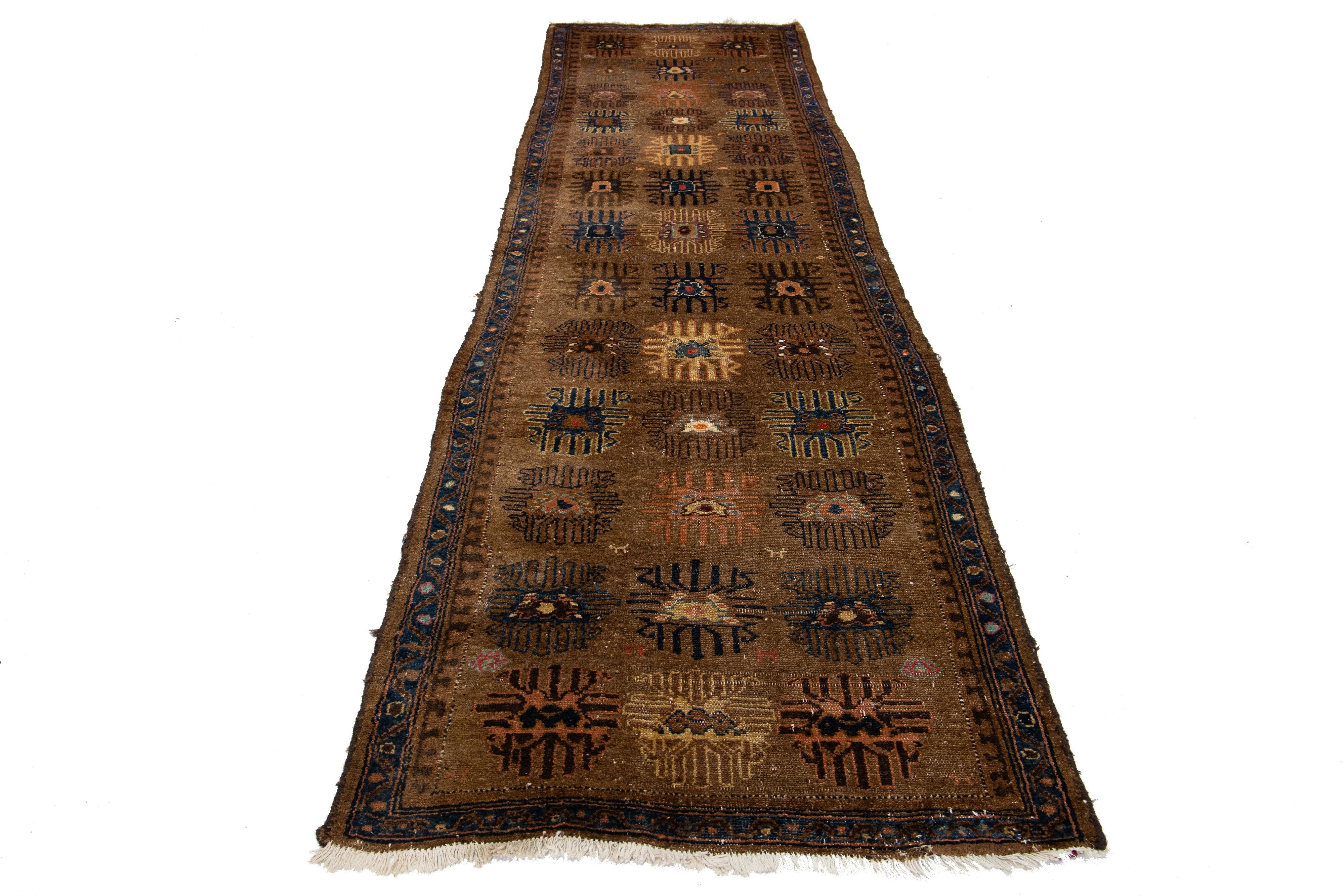 Antique Hamadan Persian runner with premium wool and captivating all-over design in beige and blue accents on a brown background.

This rug measures 3'5