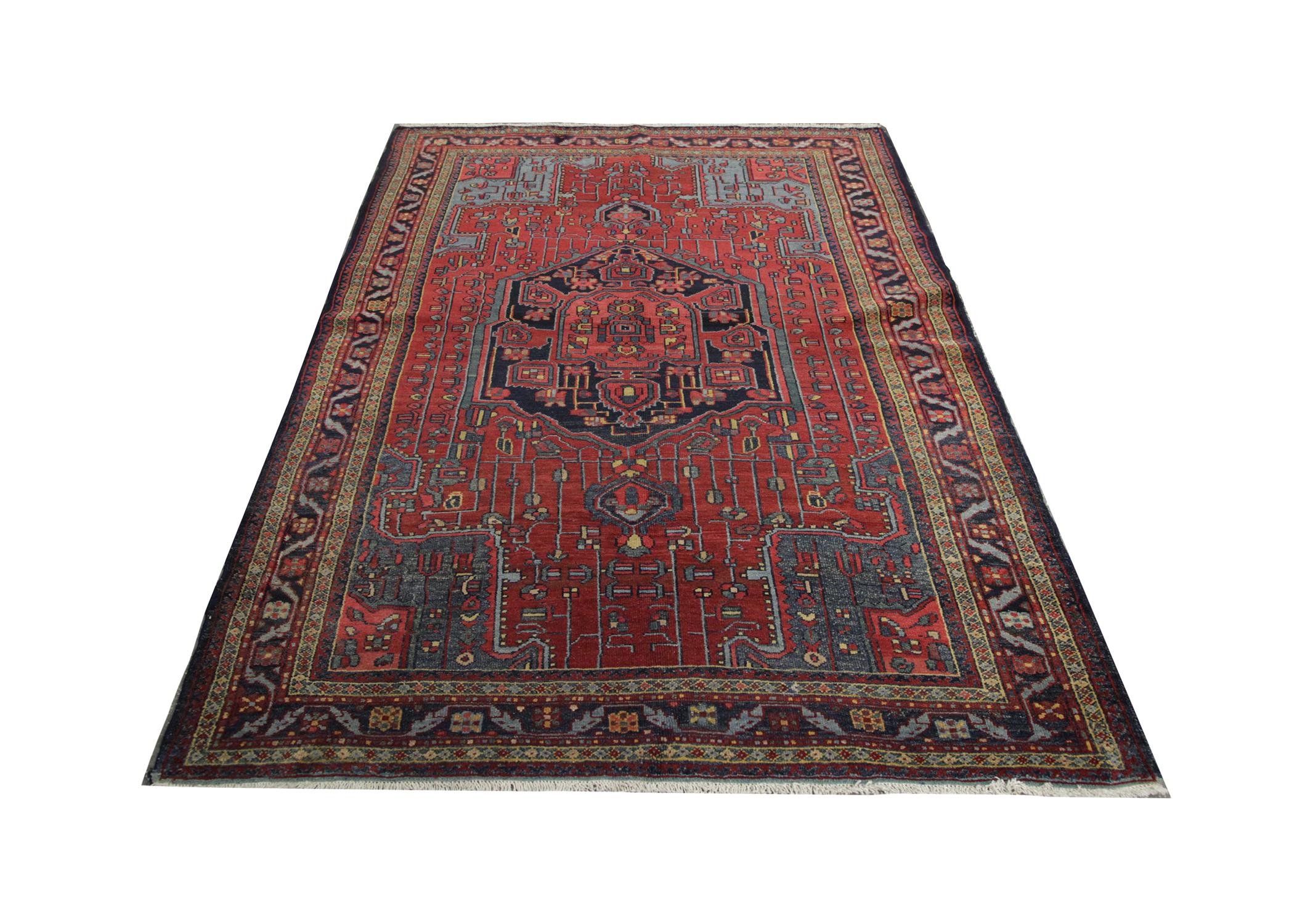 Featuring a highly-detailed handmade carpet tribal Oriental rug central medallion with intricate motifs handwoven in an asymmetrical design. Woven in blue and yellow on a red background. The central design is enclosed by a detailed layered border