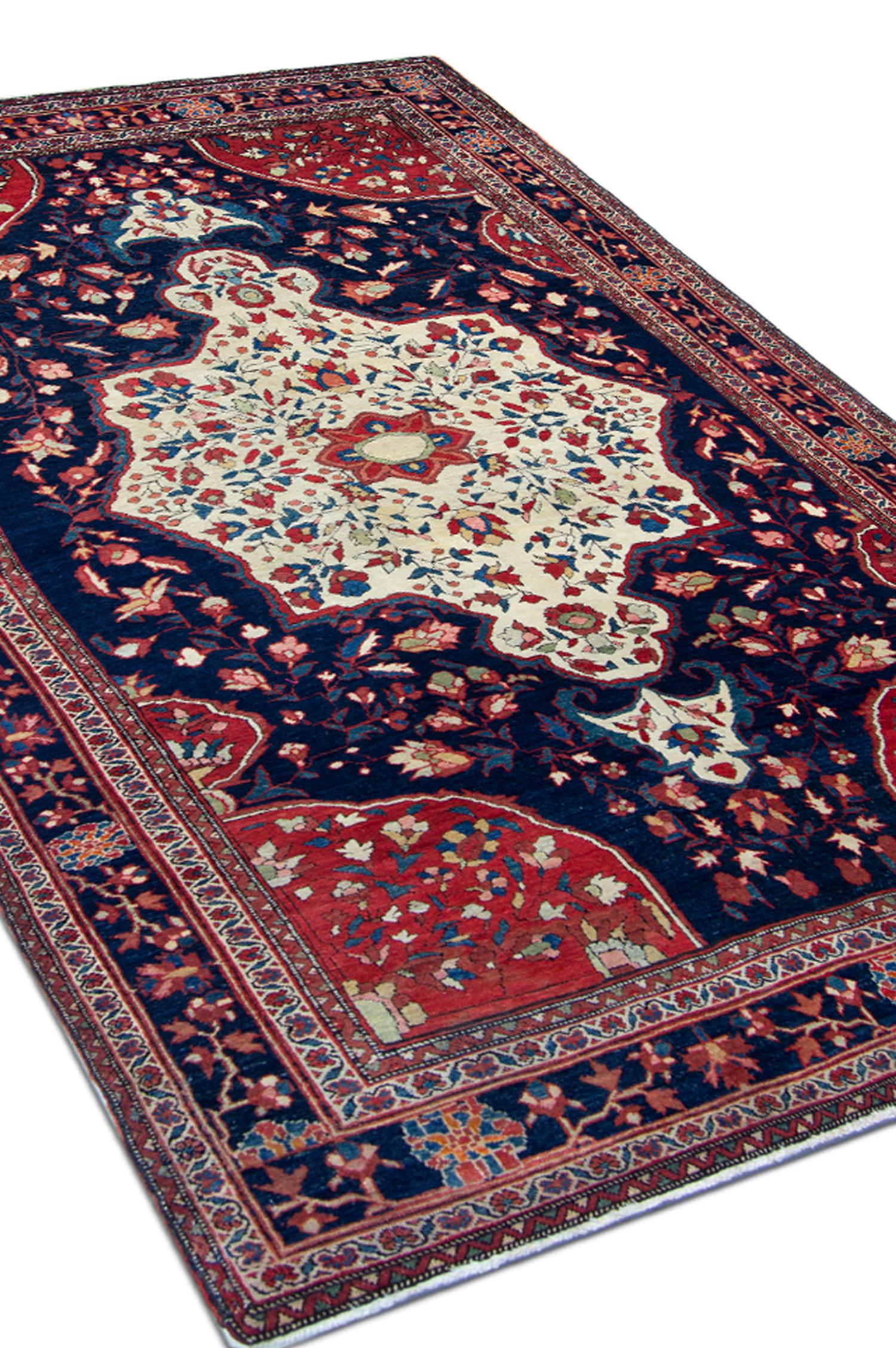 Exclusive ntique area rug was woven in the 1880s with only the finest materials. It features a deep blue background and a charming red and cream medallion in the centre, representing typical traditional design. The colour and design featured in this