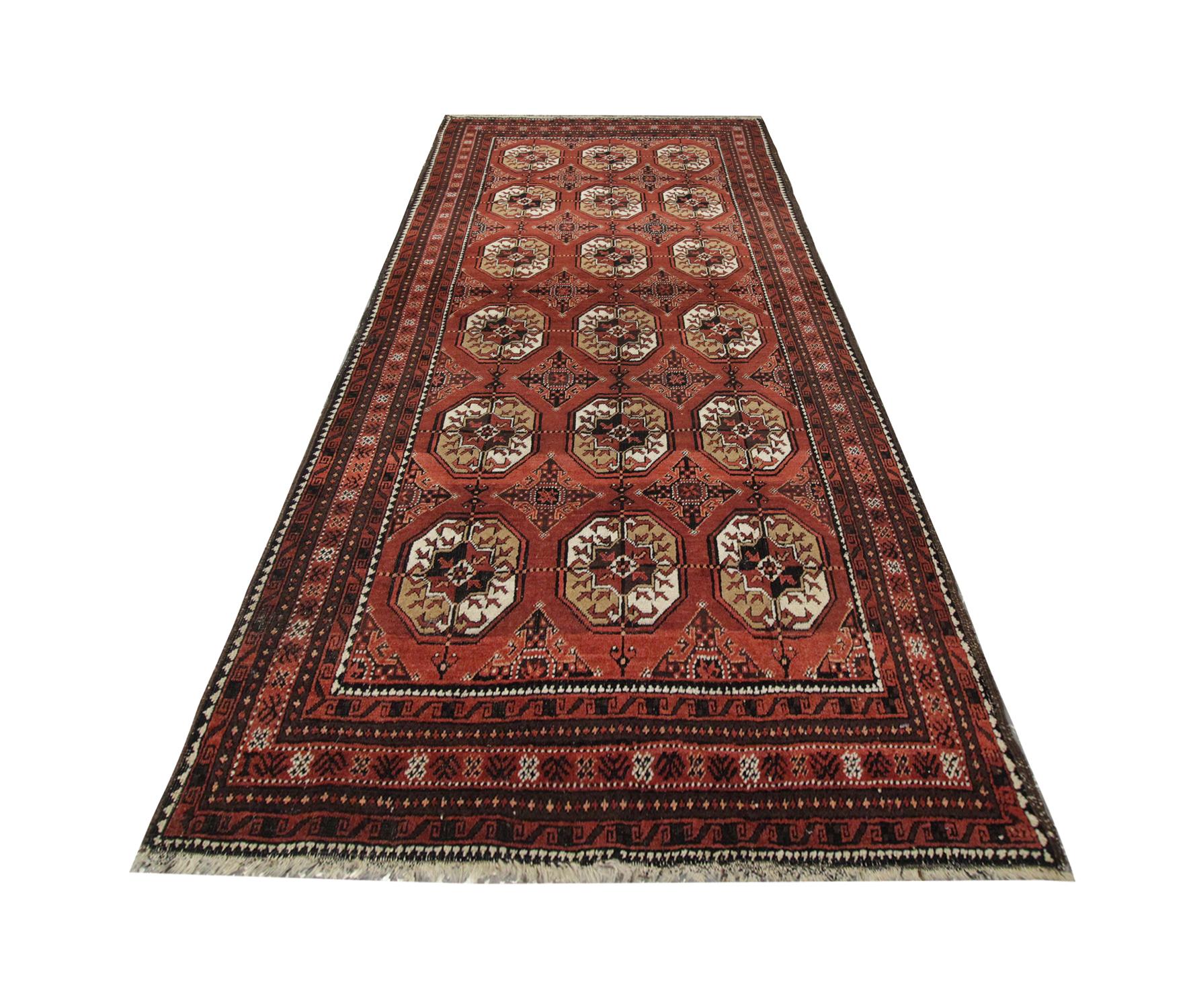 Light up your interior floors with this handmade carpet Oriental rug high-quality antique Turkmen rug, with a tribal repeat pattern, handwoven in 1940 with hand-spun, vegetable-dyed wool, and cotton, by some of the finest artisans. Perfect for both