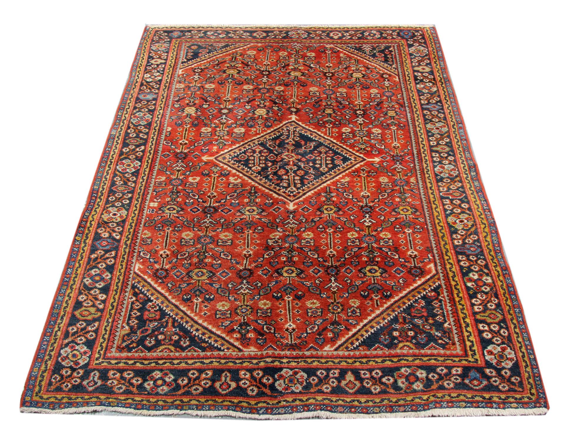 This fine wool Caucasian rug is an excellent example of geometric rugs woven in the early 20th century, circa 1900. The design is geometric, featuring a beautiful central medallion and symmetrical surrounding design with blue, beige and yellow
