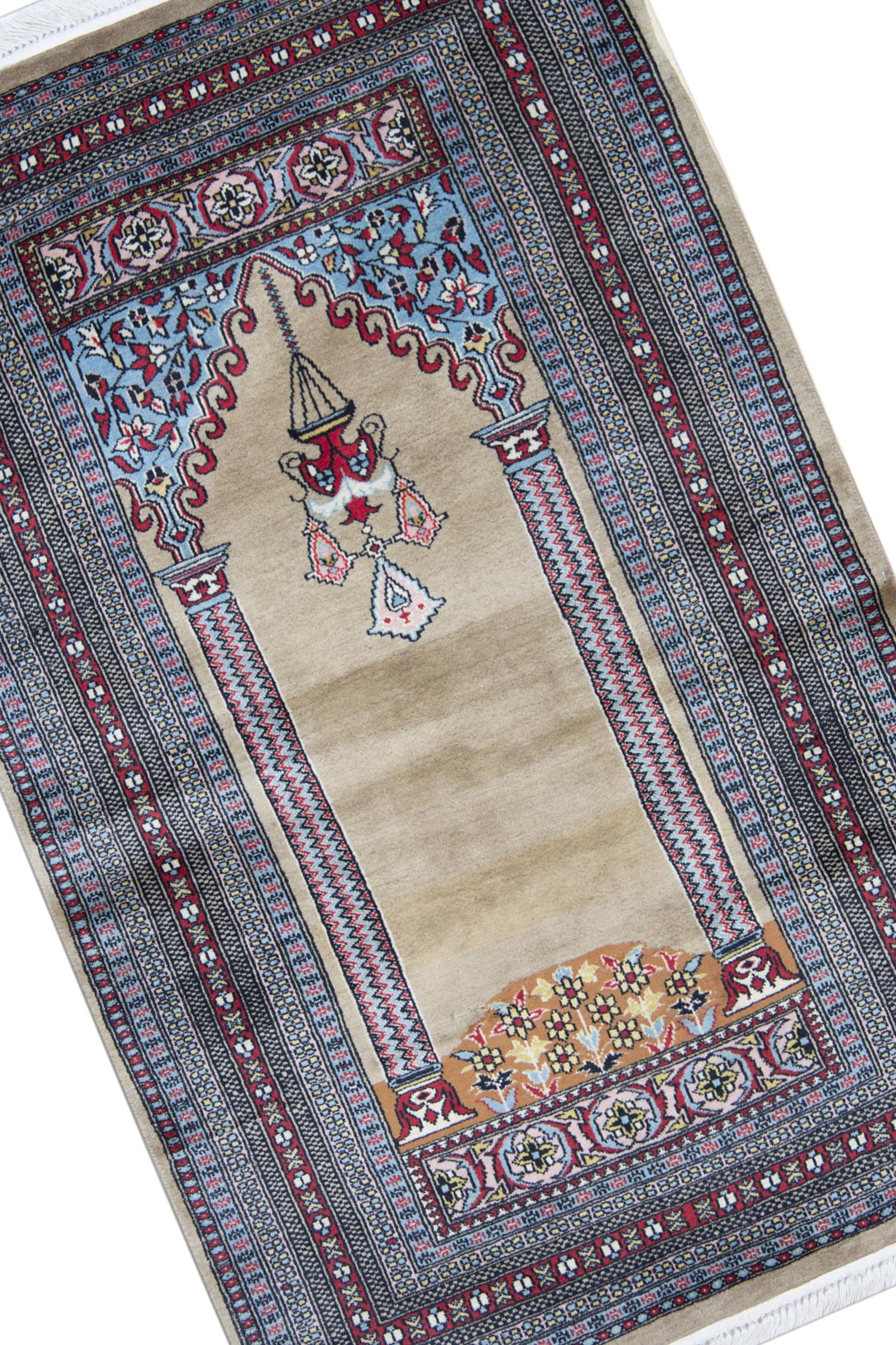 Elegantly woven with a top to bottom design, a double pillar design and chandelier design, a traditional design known to date back to 5000 BC. The delicate design and floral patterns through the border make this rug the perfect accent piece for any