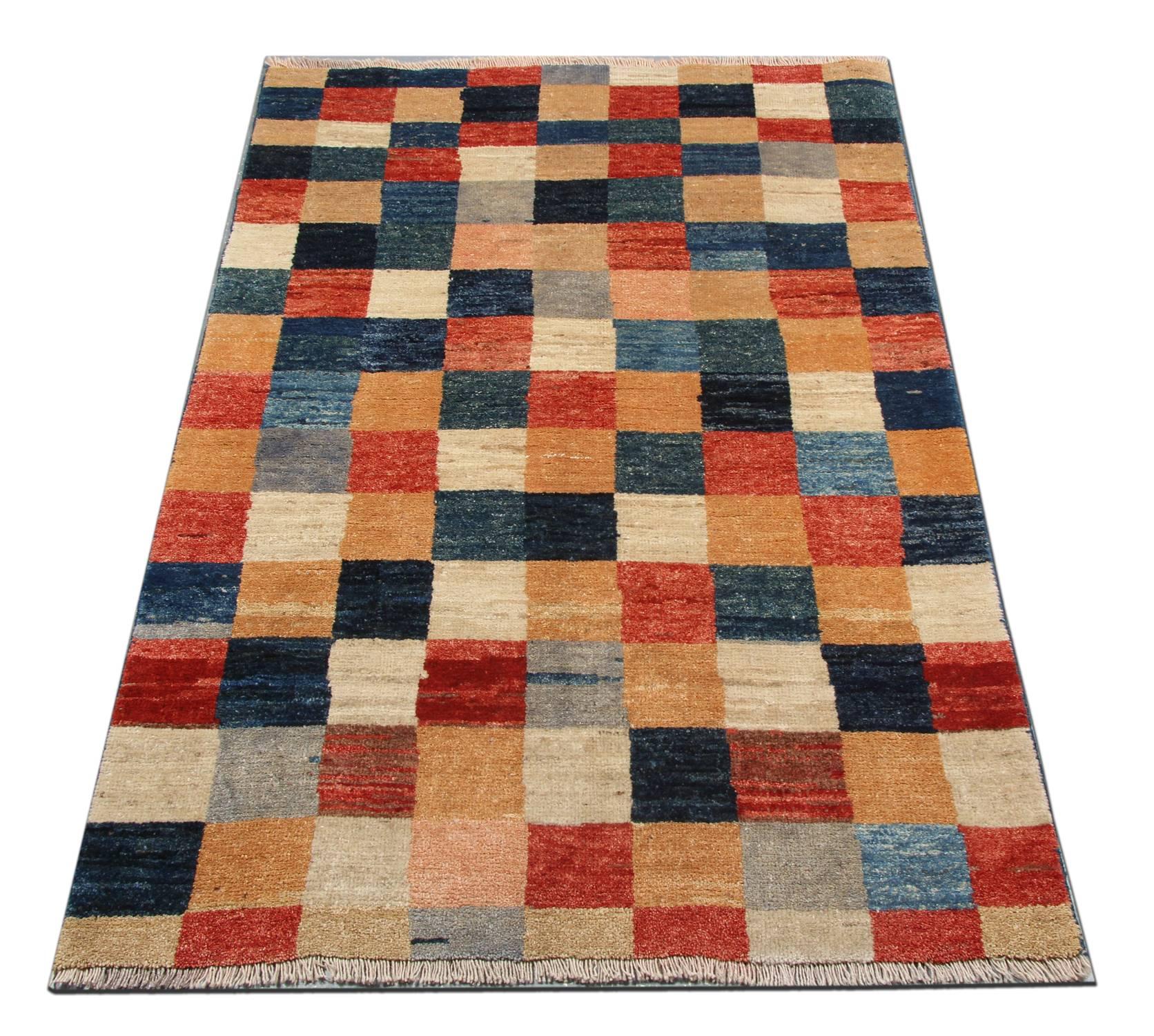 Handmade carpet wool rugs have rich colors and abstract elements and these modern rugs give a subtle contemporary appearance. This geometric Oriental rug is featuring a beautiful plaid palette of blue, gold, navy, rust, ivory and grey rug colors.