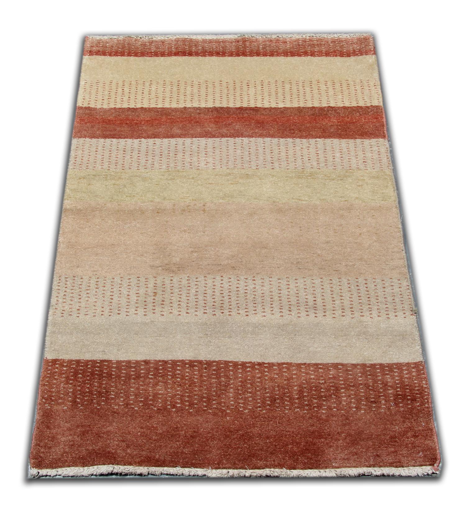 This carpet features a modern striped design with rich colors of burnt orange and beige, this modern rug gives a subtle uplift to any room. Featuring a beautiful Minimalist design and stylish colors this contemporary carpet will add a touch of