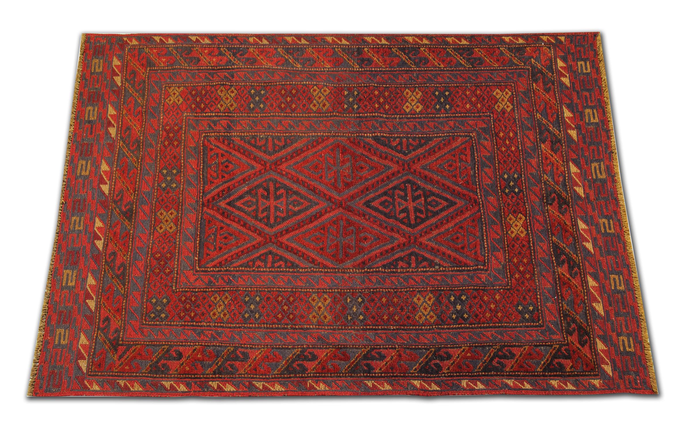 This is an example of fine afghan red rug made by highly skilled Turkman handmade rugs weavers in the north of Afghanistan. They have used hand-spun wool and 100% organic dyes for the production of these wool rugs. This tribal rug has repeating