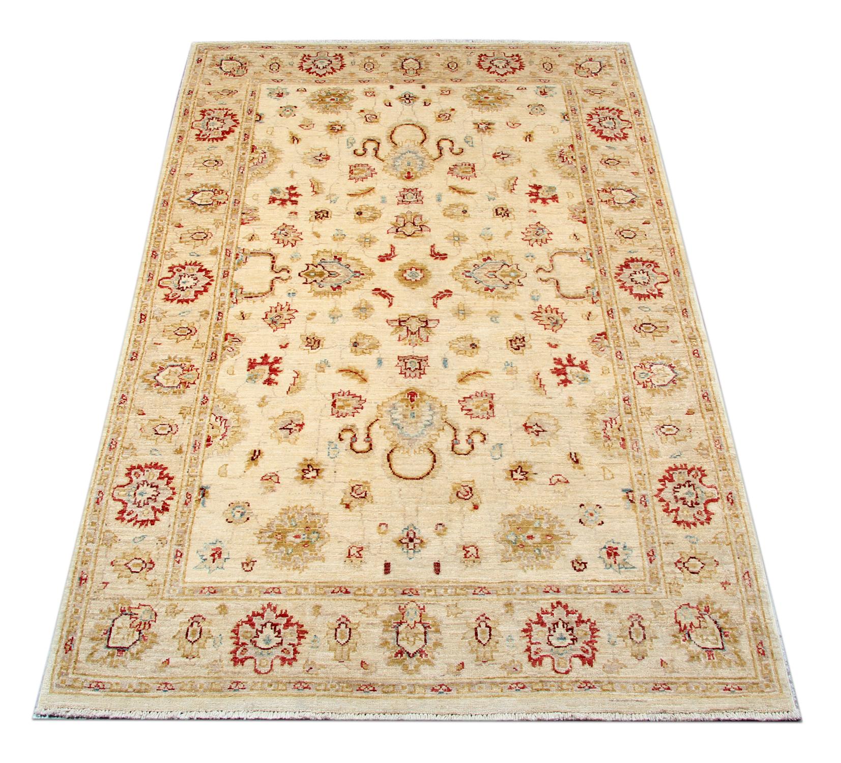 This rug is a Ziegler Sultanabad rug was constructed on our looms by our master weavers in Afghanistan. Featuring a cream and beige floral design woven on an ivory background and a bold red border. handmade with all-natural veg dyes all hand-spun