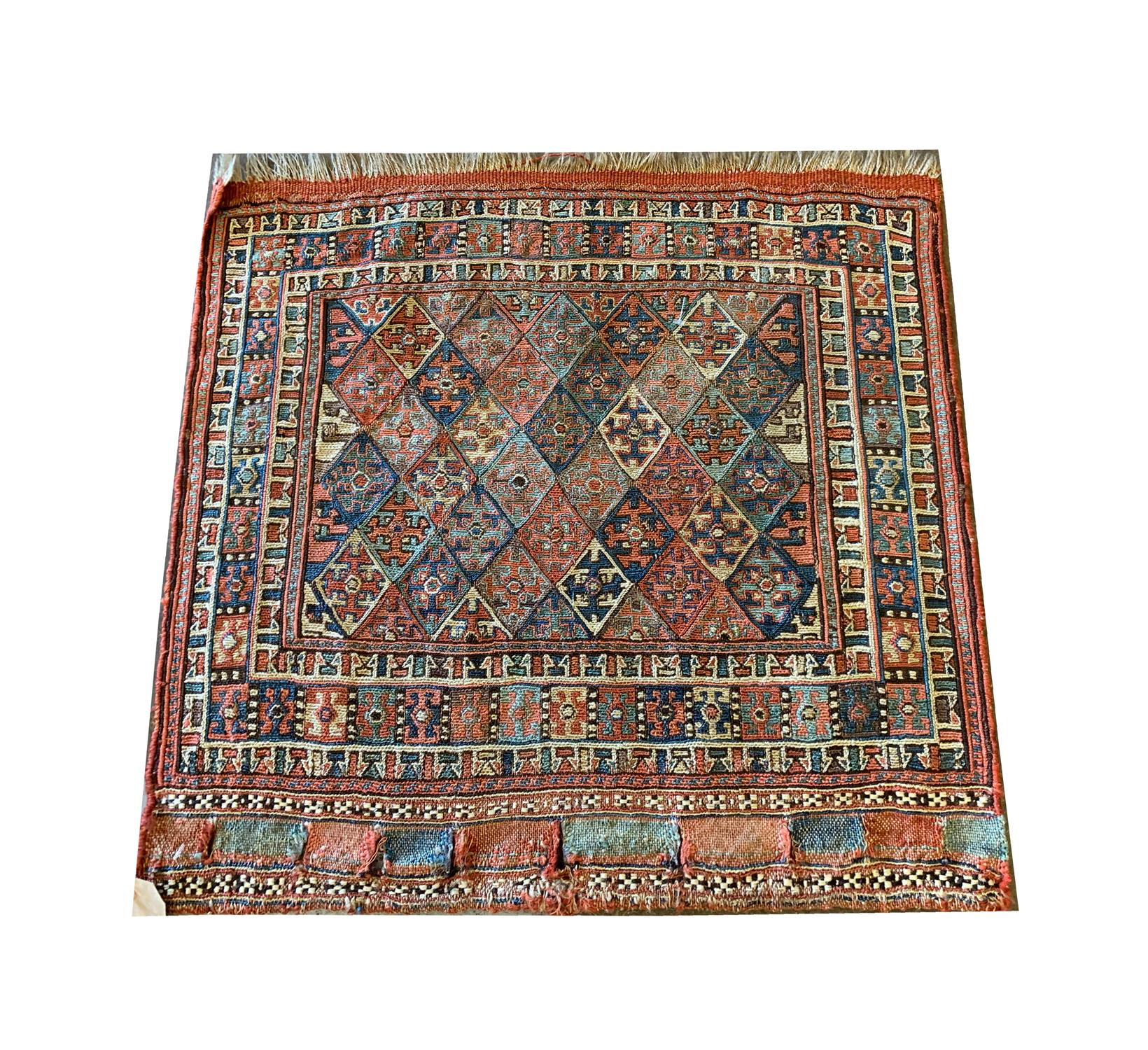 This elegant handmade Kilim was woven in Caucasia in the 1880s and features a fantastic geometric design. Intricately woven with accents of rust, blue, red, beige and cream that make up the repeat hook motif pattern and the layered border. This