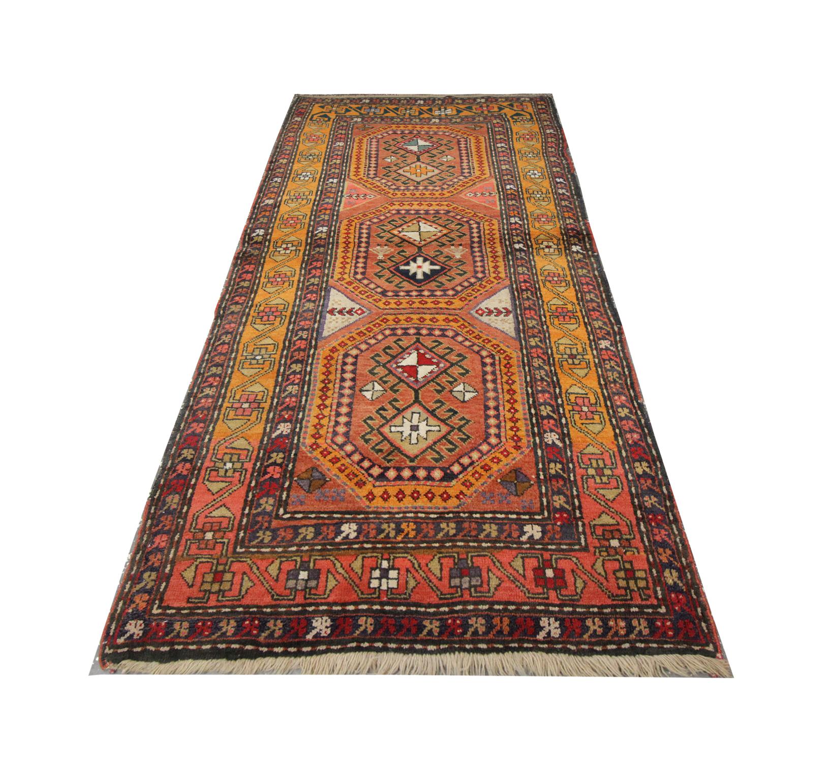 The multi-layered border is beautifully woven with a repeat pattern throughout. The contrast between the orange and brown hues works perfectly to create this eye-catching one of a kind antique rug. This stunning intricately detailed area rug has