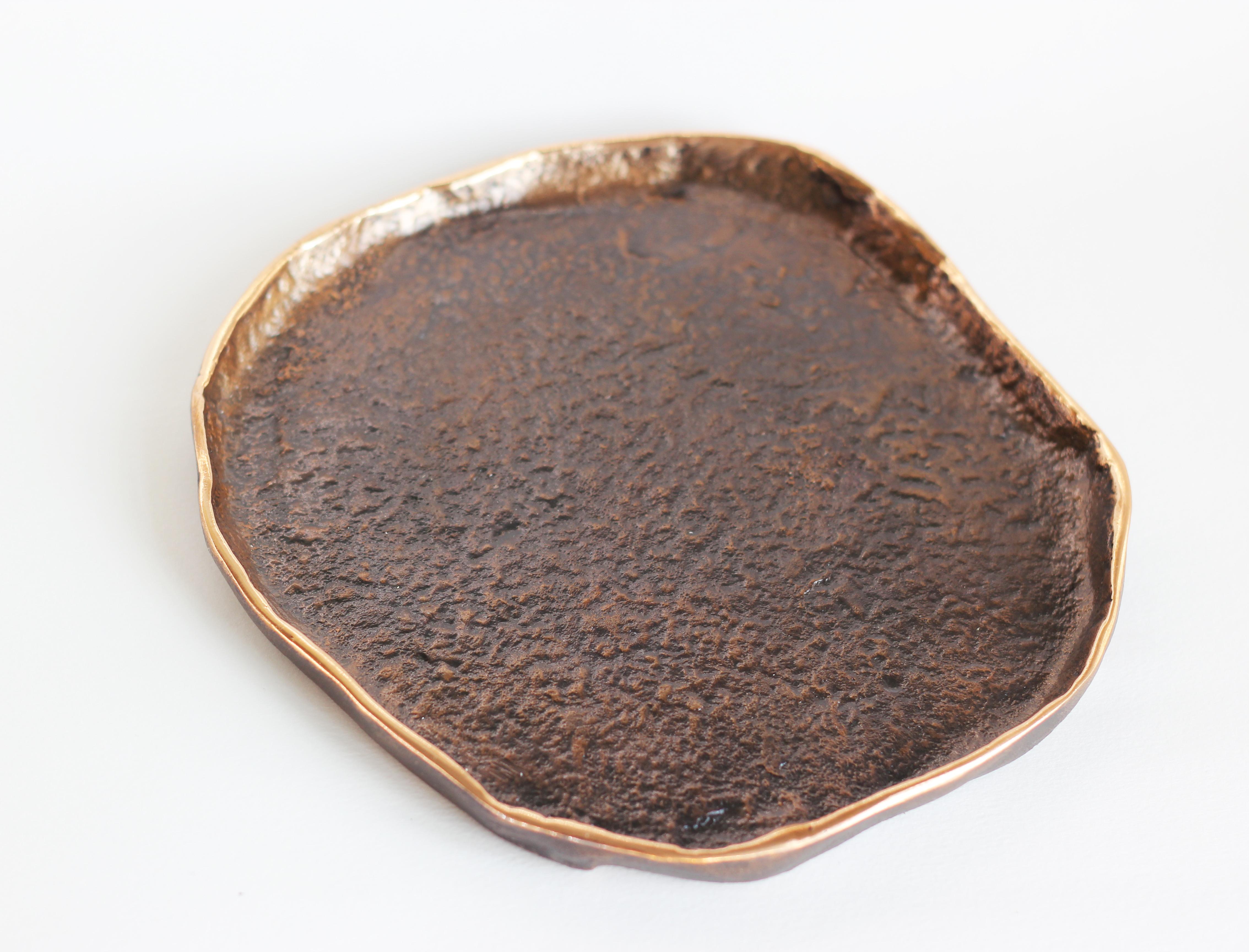 Graceful bronze tray, vide-poche, inspired by Wabi-Sabi, the ancient Japanese philosophy that views and embraces the world for its imperfections and transient nature. It translates into an exquisite aesthetic that is imperfect and incomplete, yet