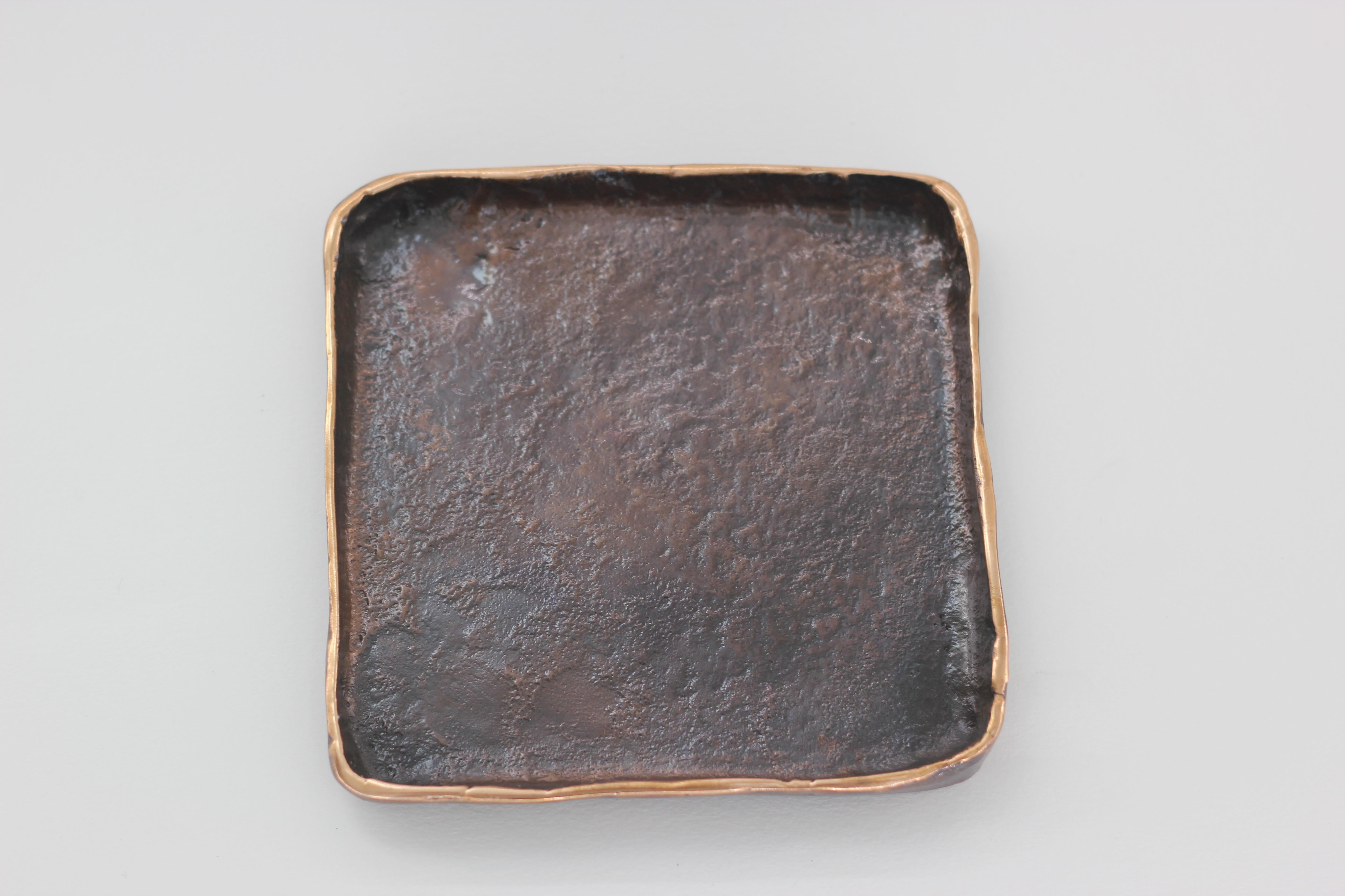 Graceful bronze tray, vide-poche, inspired by Wabi-Sabi, the ancient Japanese philosophy that views and embraces the world for its imperfections and transient nature. It translates into an exquisite aesthetic that is imperfect and incomplete, yet