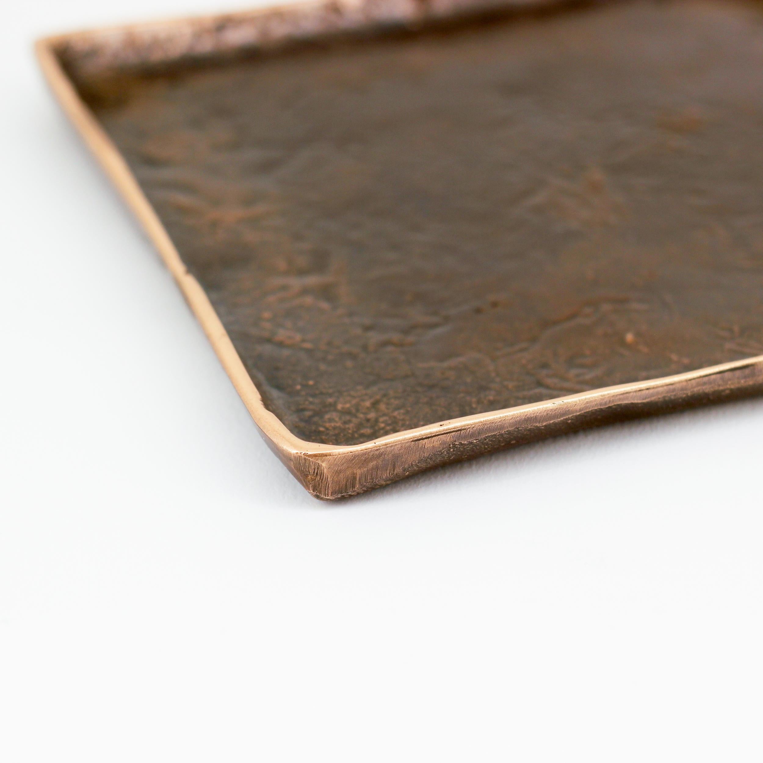 Graceful bronze tray, vide-poche, inspired by Wabi-Sabi, the ancient Japanese philosophy that views and embraces the world for its imperfections and transient nature. It translates into an exquisite aesthetic that is imperfect and incomplete, yet